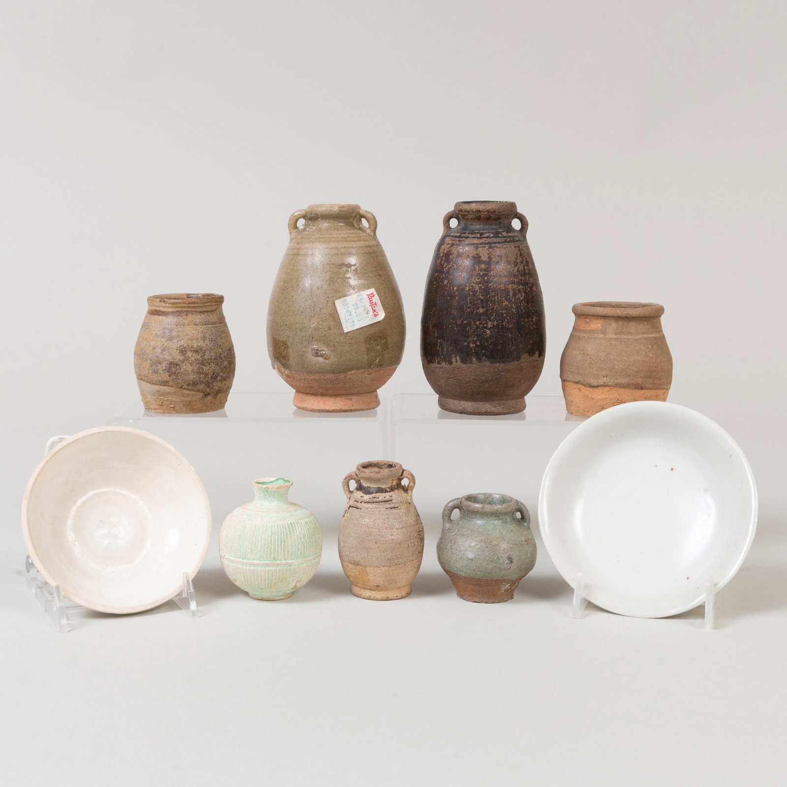 Group of Chinese Porcelain and Earthenware Vessels: Group of Chinese Porcelain and Earthenware Vessels Comprising: Two small dishes Two small vases with lug handles Two small jarlets Two small jarlets with lug handles A ribbed jarlet The largest 4 3/4 