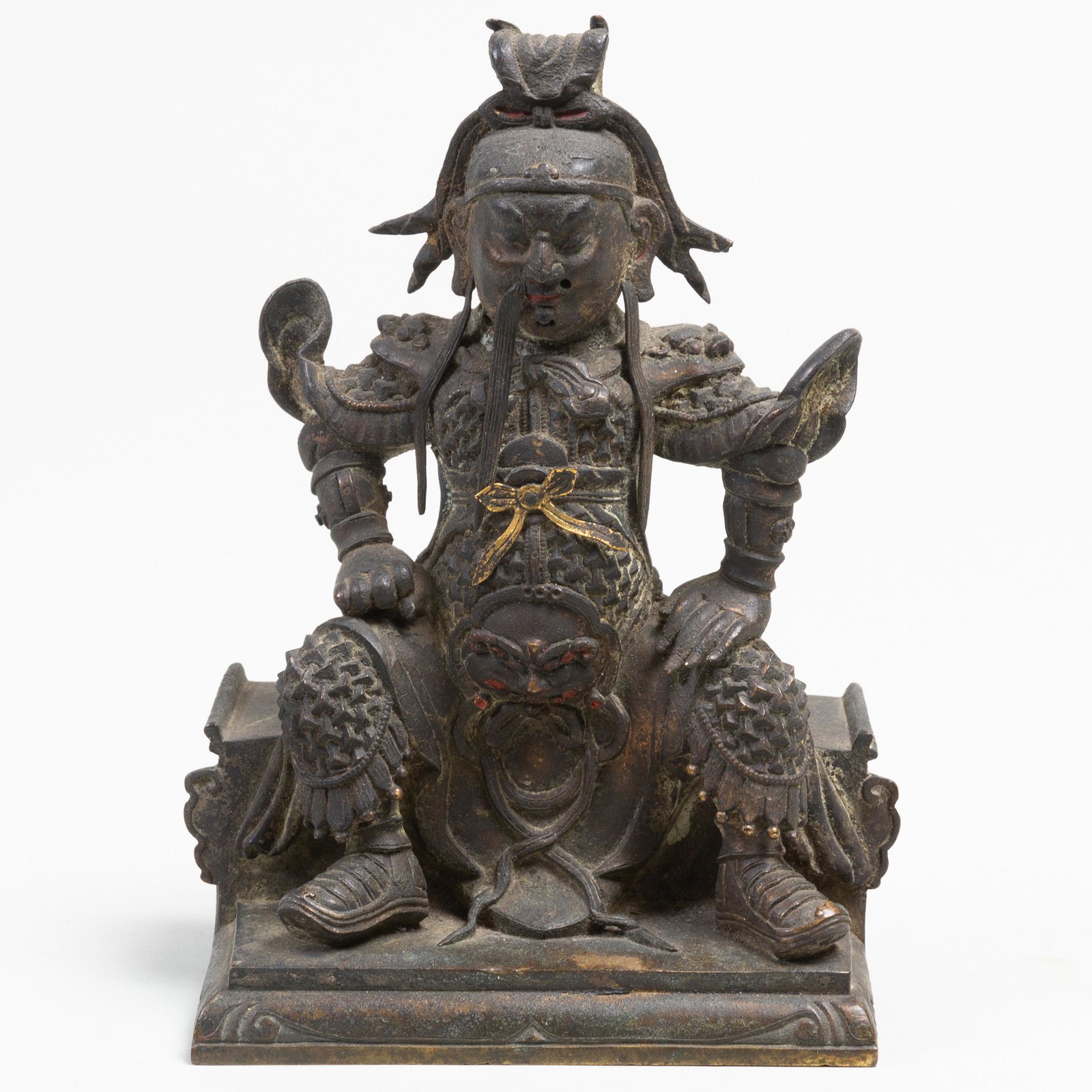 Chinese Bronze Figure of Guandi: Chinese Bronze Figure of Guandi Dressed in full armor under a long robe seated on a bench, double vajra on the base. 7 1/2 in. high. Property from a Distinguished Gentleman, New York City