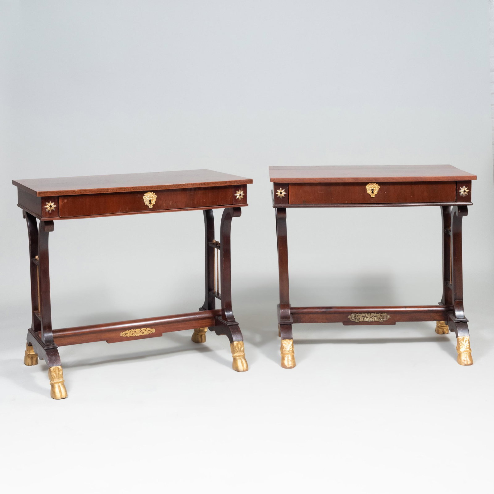 Pair of North European Neoclassical Gilt-Metal-Mounted: Pair of North European Neoclassical Gilt-Metal-Mounted Mahogany and Parcel-Gilt Console Tables 29 1/4 x 32 1/4 x 19 3/4 in.