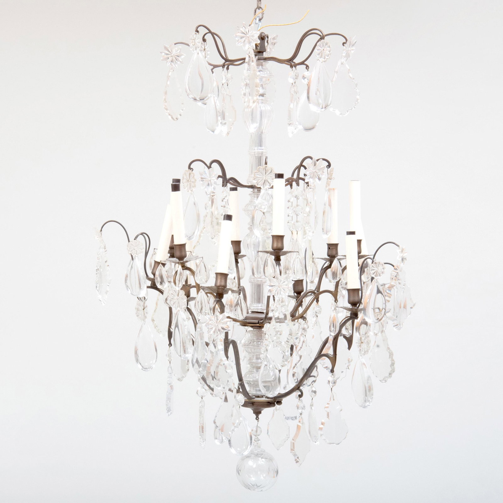 Louis XV Style Bronze and Brass-Mounted Glass Twelve: Louis XV Style Bronze and Brass-Mounted Glass Twelve Light Chandelier Fitted with a central glass stem issuing candle branches and pendant and tear drop sprays, ending in a ball terminal. 38 1/2 x 27 