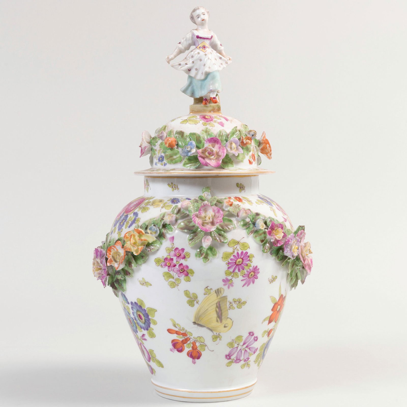 Continental Porcelain Vase and Cover with Figural: Continental Porcelain Vase and Cover with Figural Finial Blue 'E' over crossed sword mark. 15 in. high.