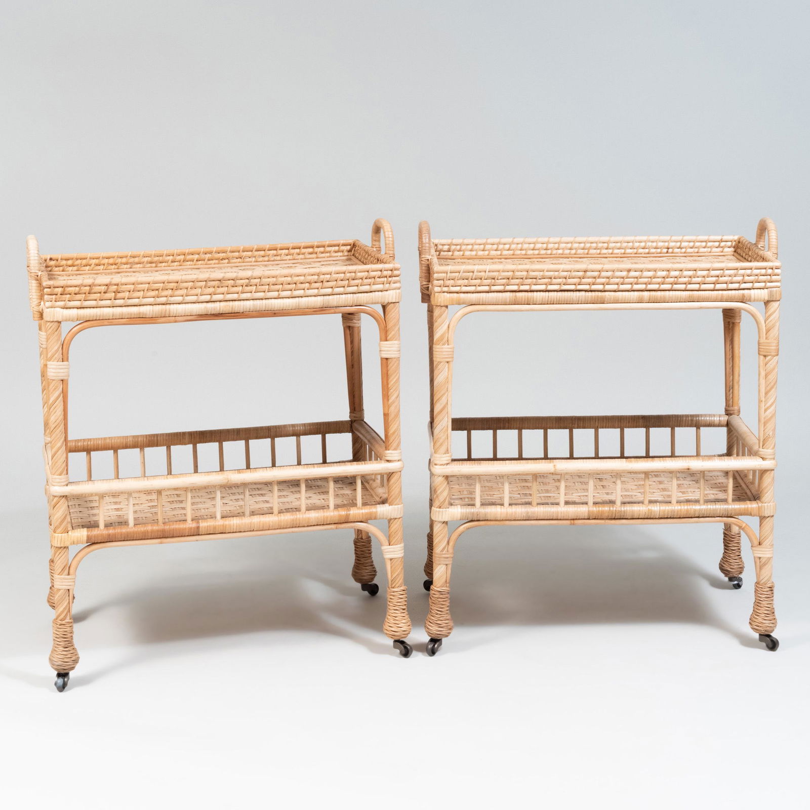 Pair of Wicker Two Tier Bar Carts, of Recent: Pair of Wicker Two Tier Bar Carts, of Recent Manufacturer 33 x 27 1/2 x 15 1/4 in.