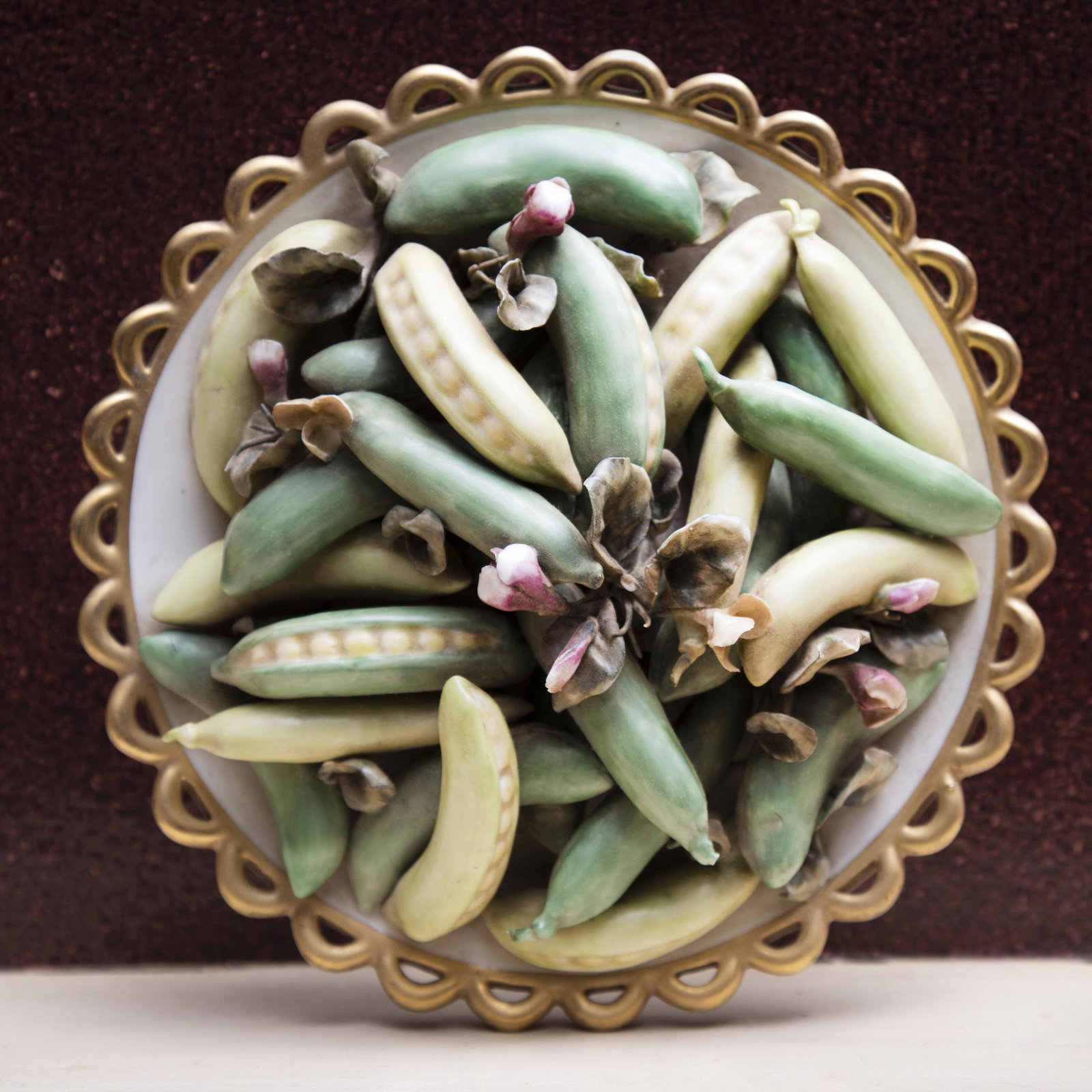Pair of Italian Mottahedeh Trompe L'Oeil Models of Peas: Pair of Italian Mottahedeh Trompe L'Oeil Models of Peas Black painted and printed marks. 3 1/2 x 8 in. diam.
