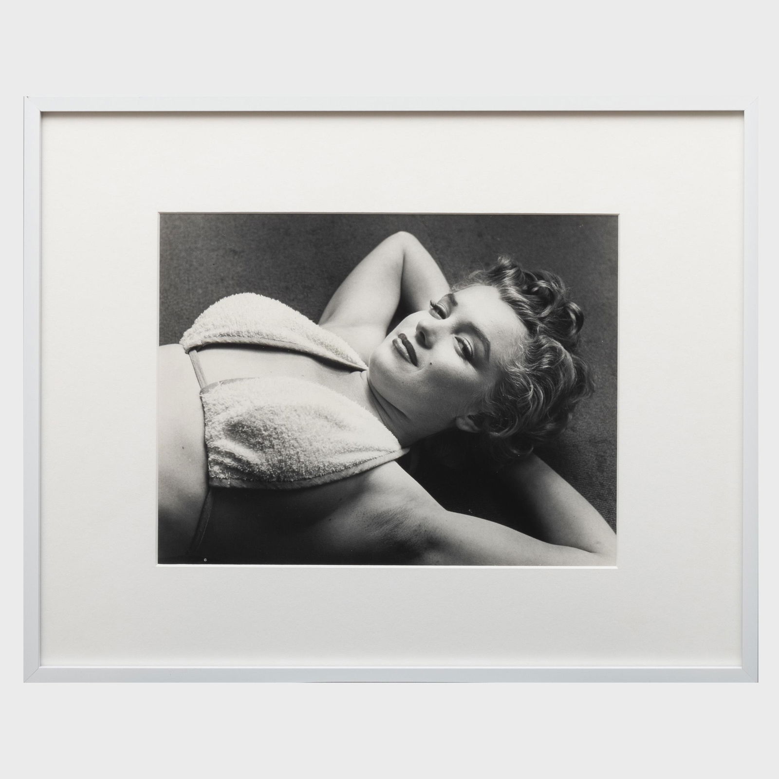Philippe Halsman (1906-1979): Marilyn Flirting: Philippe Halsman (1906-1979): Marilyn Flirting Gelatin silver print, 1952, with the artist's inkstamp and numbered 181/250 on the reverse, 11 x 14 in. (sheet), 16 1/4 x 20 1/4 in. (frame).
