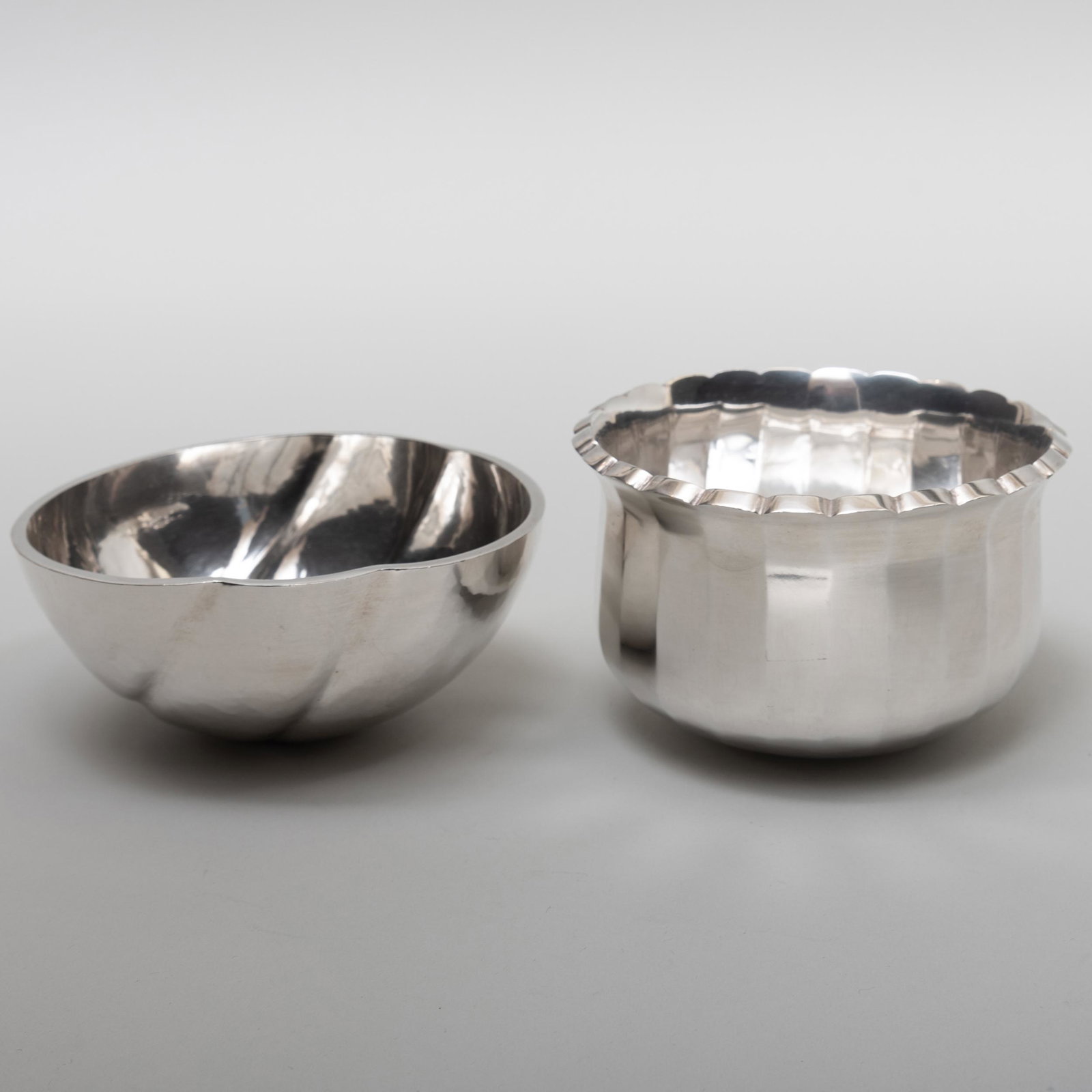 Modernist Claes Giertta Swedish Silver Bowl and a: Modernist Claes Giertta Swedish Silver Bowl and a Scalloped Karlheinz Sauer Swedish Silver Bowl The first marked Stockholm, '.925', 1998; the second marked Vasteras, 1988. The larger 5 1/8 in. diam., 
