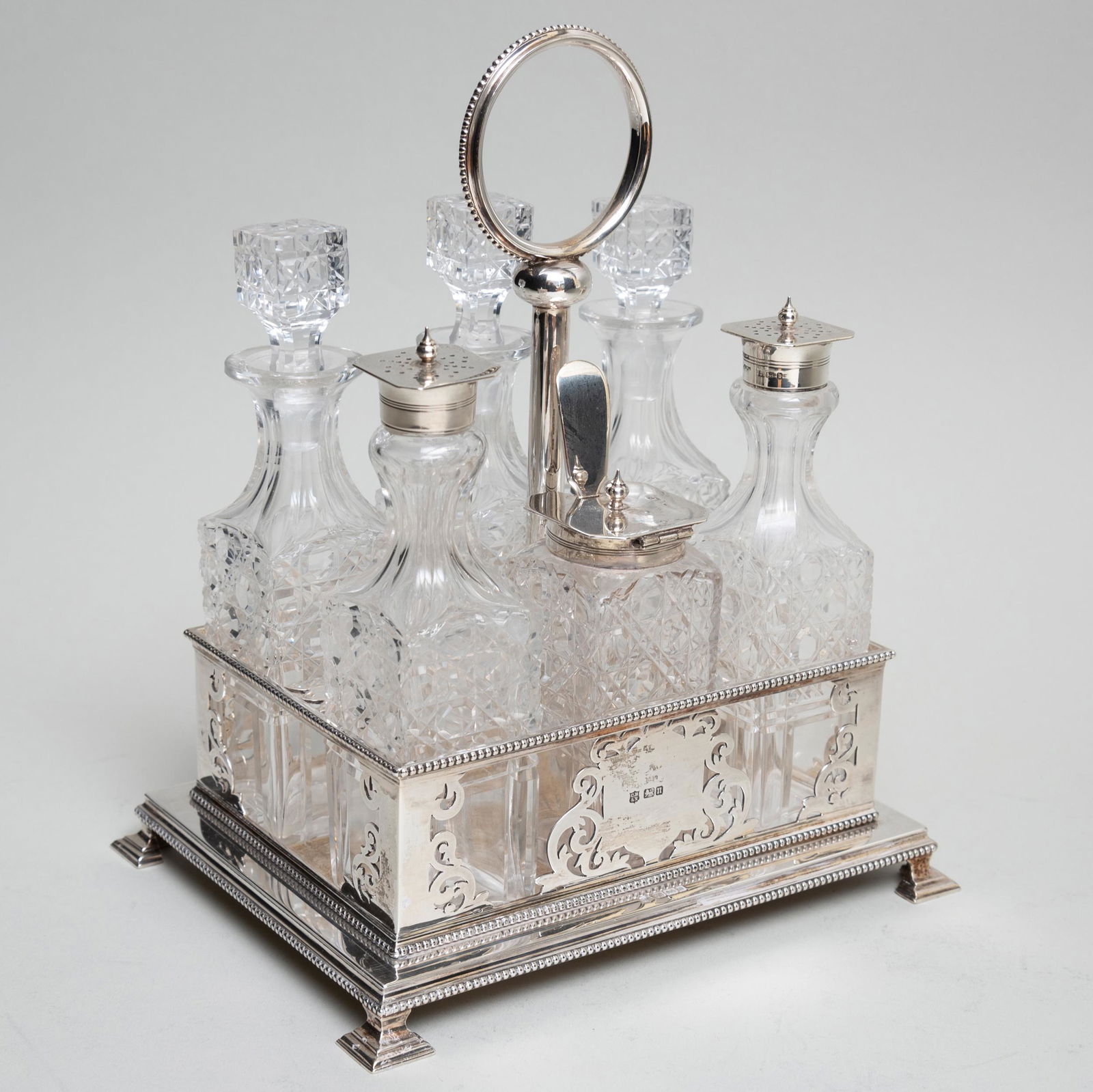 Assembled Edward VII Silver and Cut Glass Cruet Set: Assembled Edward VII Silver and Cut Glass Cruet Set The stand with mark of Cooper Brothers & Sons, Sheffield, 1905; the cruet mounts mark of Henry Bushell & Co., Birmingham, 1901. 10 1/4 in. high, 36.