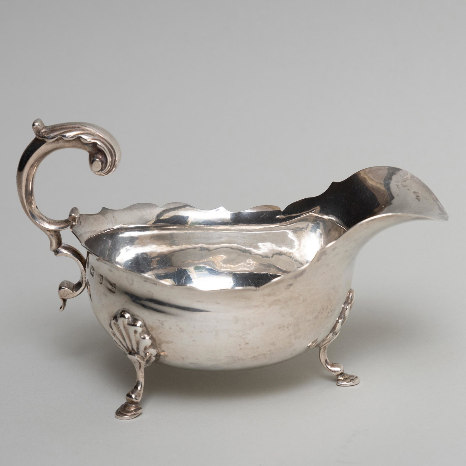 Victorian Silver Sauce Boat: Victorian Silver Sauce Boat Mark of George Nathan & Ridley Hayes, Birmingham, 1876. 6 3/4 in. long, 6.6 oz. approx. weight. Sold Stair Galleries, March 10, 2012, Lot 913.