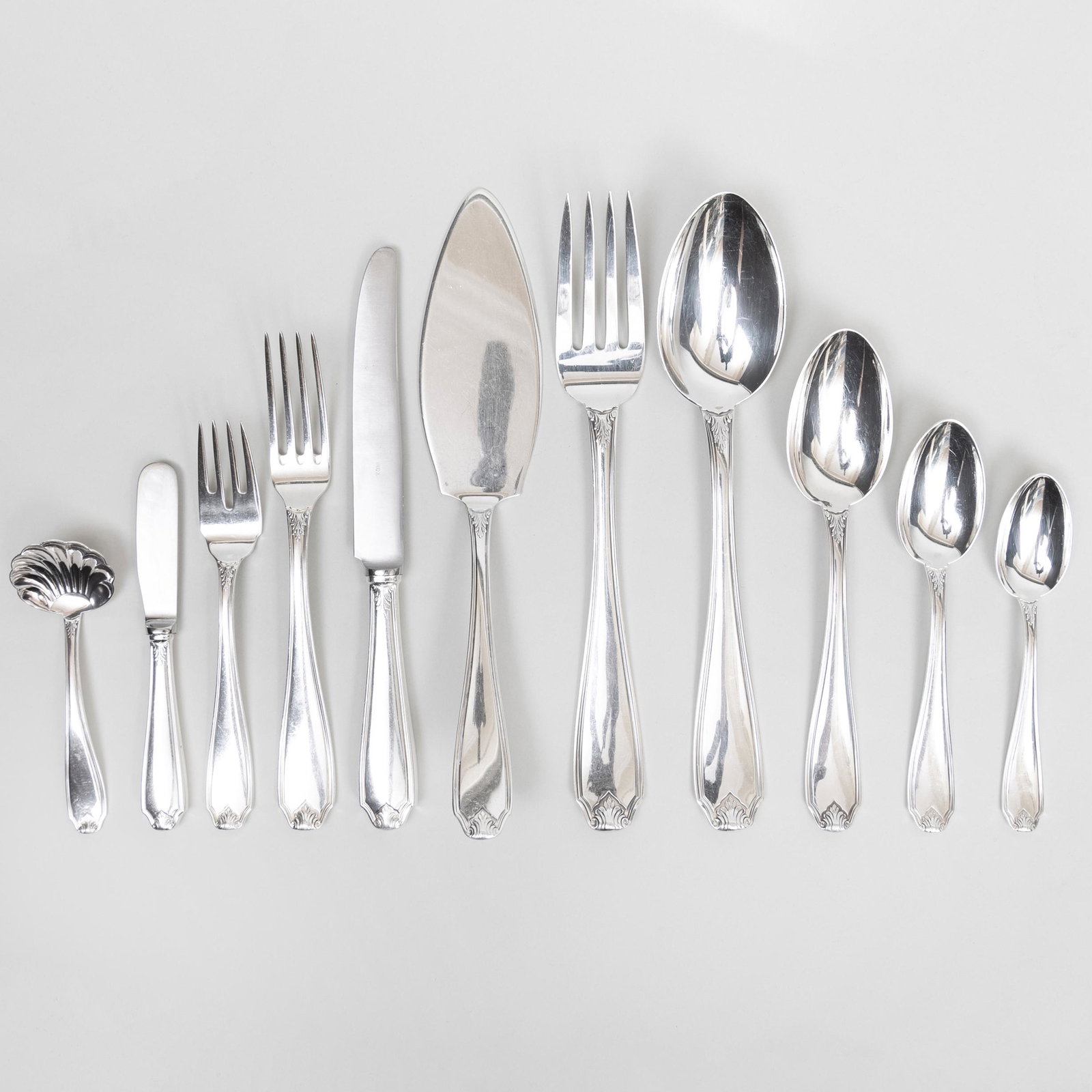 Buccellati Silver Plate Flatware Service: Buccellati Silver Plate Flatware Service Comprising: Twelve dinner knives with steel blades and filled handles Six butter spreaders with steel blades and filled handles Twelve dinner forks Twelve sala