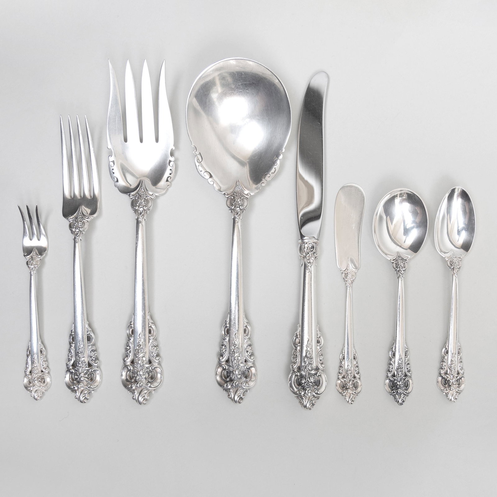Wallace Silver Flatware Service in the 'Grand Baroque': Wallace Silver Flatware Service in the 'Grand Baroque' Pattern Marked 'Sterling'. Comprising: Twelve dinner knives Twelve dinner forks Twelve salad forks Twelve soup spoons Twenty-four teaspoons Twel