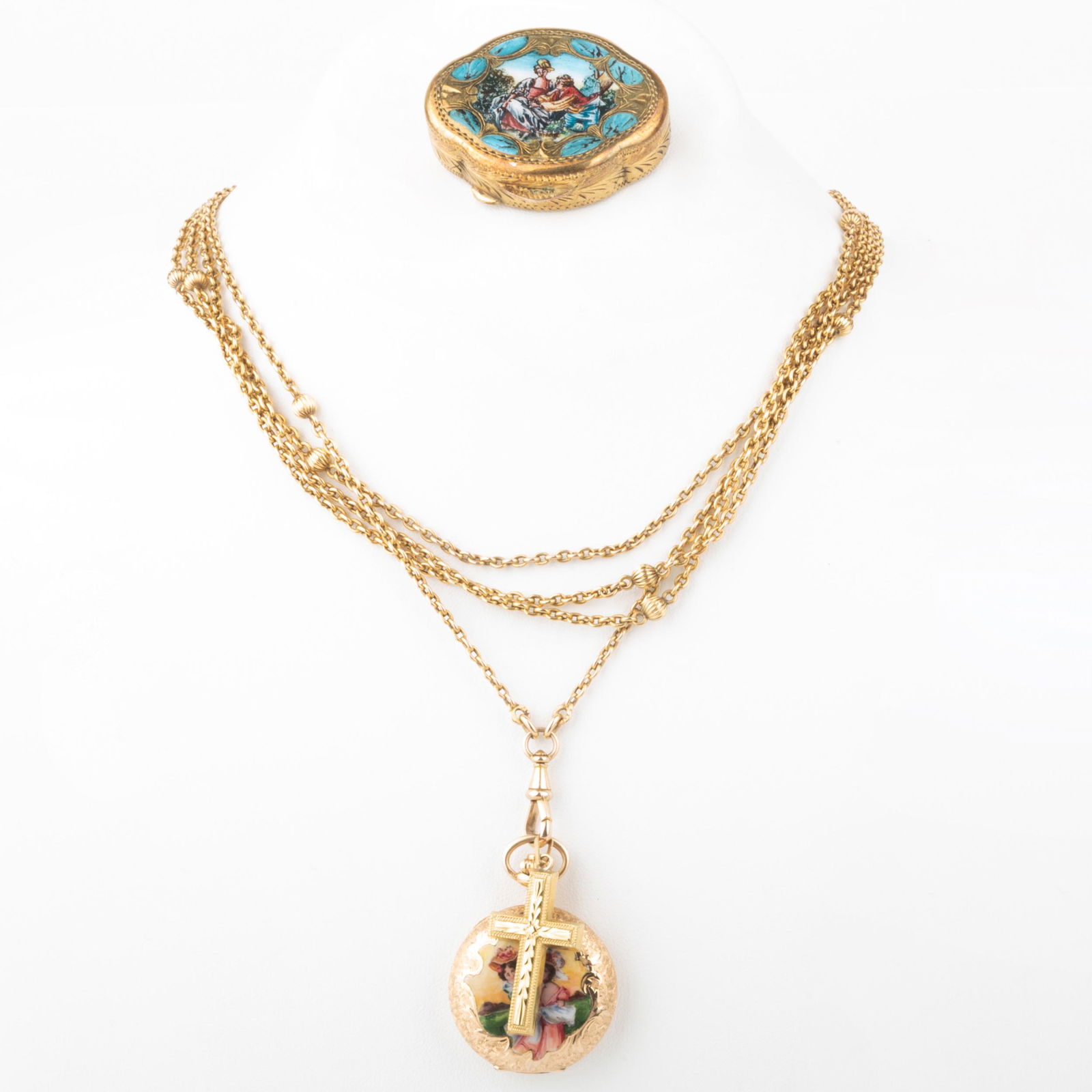 14k Gold and Enamel Pocket Watch on a 14k Gold Long: 14k Gold and Enamel Pocket Watch on a 14k Gold Long Watch Fab Chain, an Enameled Pill Box and a 14k Gold Cross Pendant Watch marked '157047 / 047', the fab with hallmark, the box unmarked and the pend