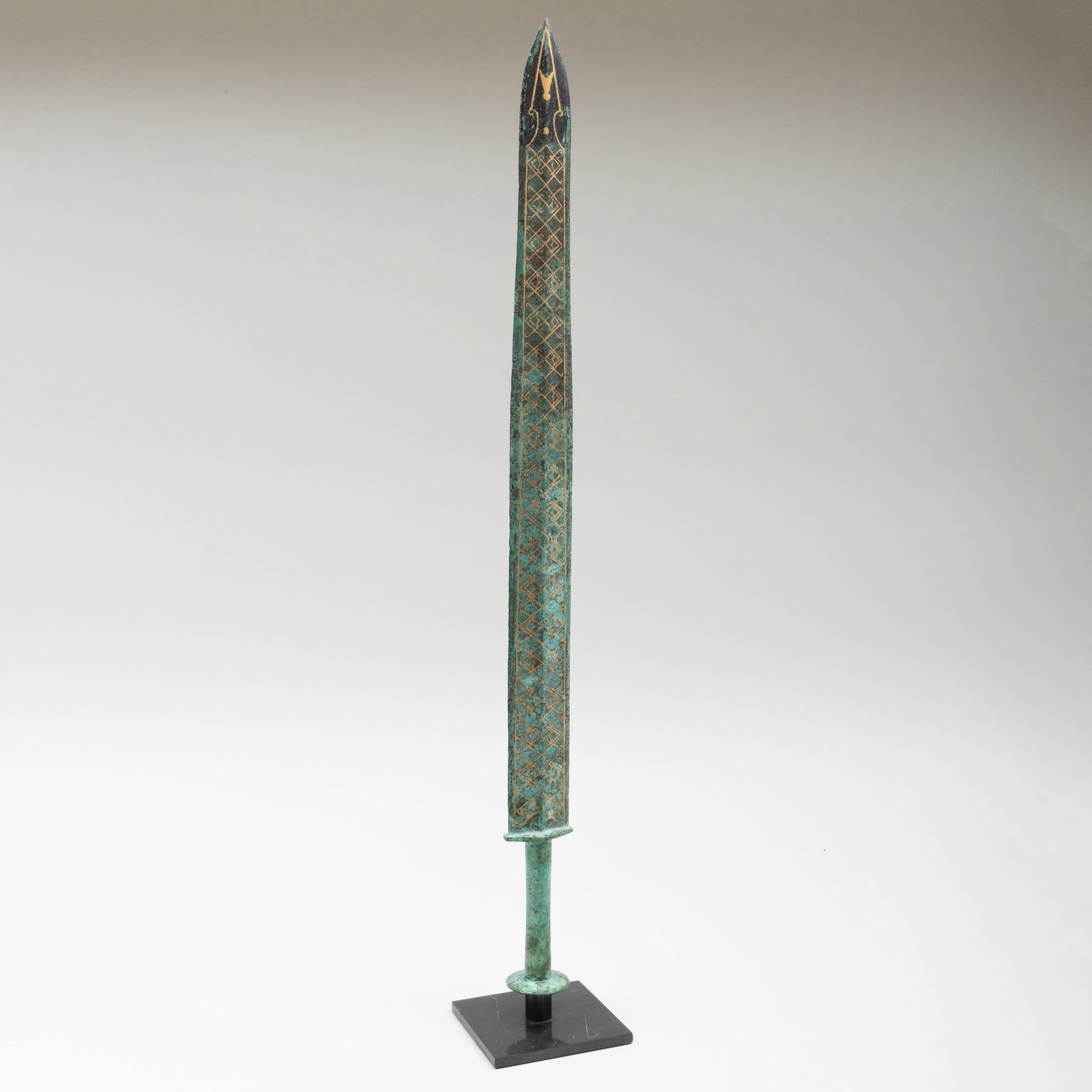 Chinese Eastern Zhou Style Bronze Sword with Gilt: Chinese Eastern Zhou Style Bronze Sword with Gilt Decoration Riased on stand. 26 5/8 in. high (overall).