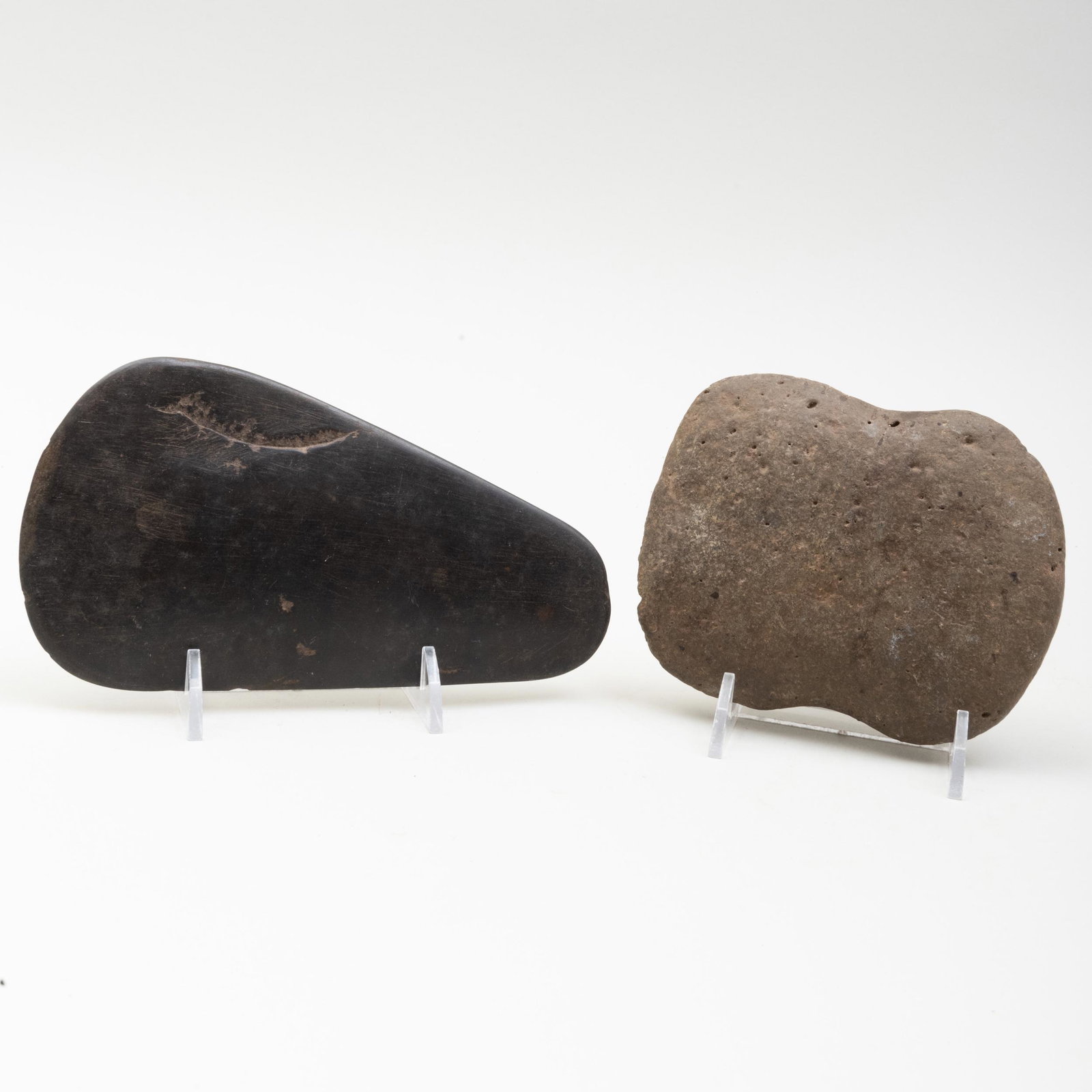 Two Neolithic Carved Stone Axe Heads: Two Neolithic Carved Stone Axe Heads The larger 6 5/8 x 3 1/2 in.