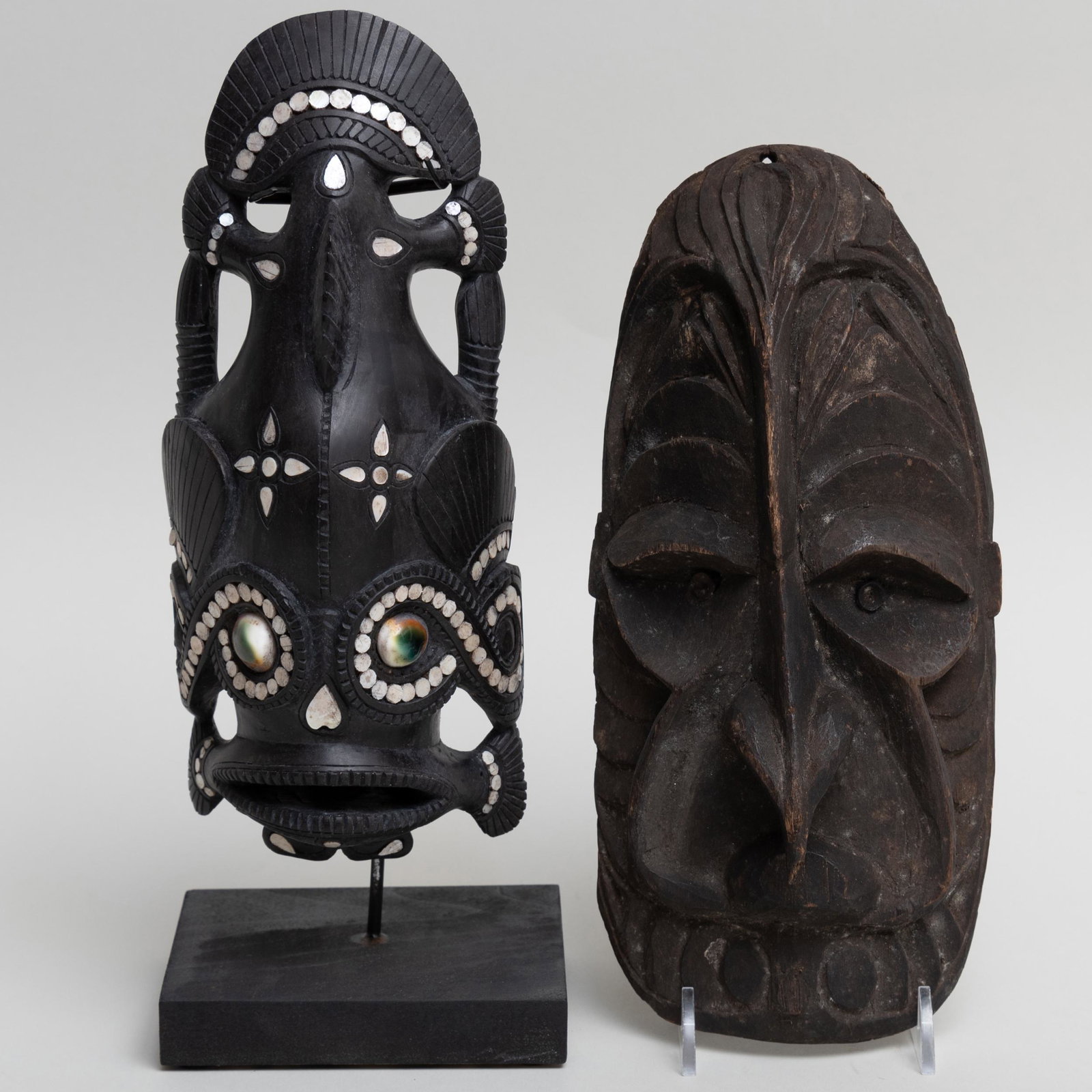 Papua New Guinea Carved Hardwood, Inlaid Shell and: Papua New Guinea Carved Hardwood, Inlaid Shell and Glass Mask, Governor of Milne Bay Together with an Oceanic Carved Wood Mask. The Papua New Guinea mask 9 x 3 7/8 x 2 3/4 in., 11 1/2 in. high (overal