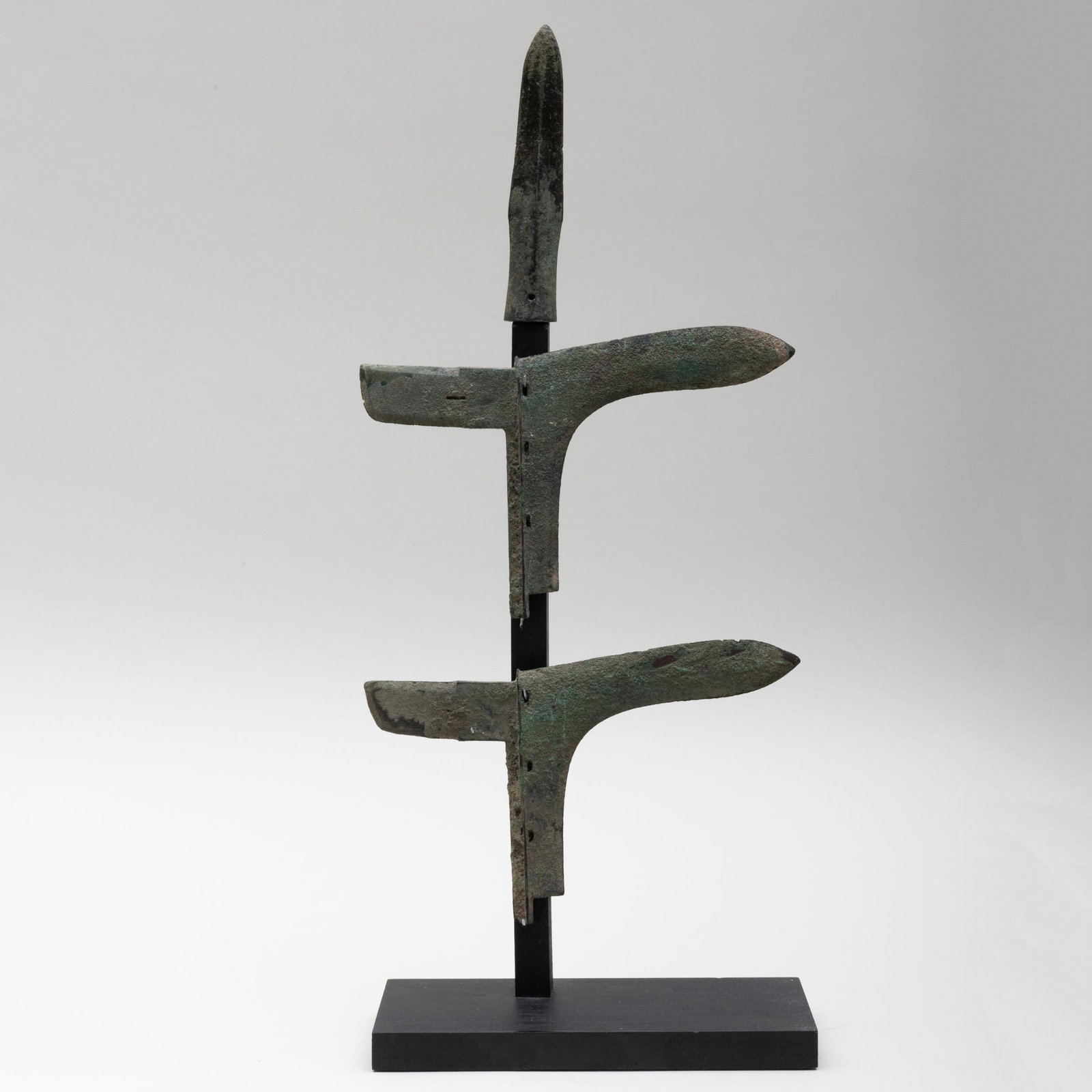 Chinese Bronze Dagger and Two Axe Heads: Chinese Bronze Dagger and Two Axe Heads Raised on stand. The dagger 6 in. long, the axe heads 9 in. long. Property from the Collection of Tom Swope, Hudson, NY