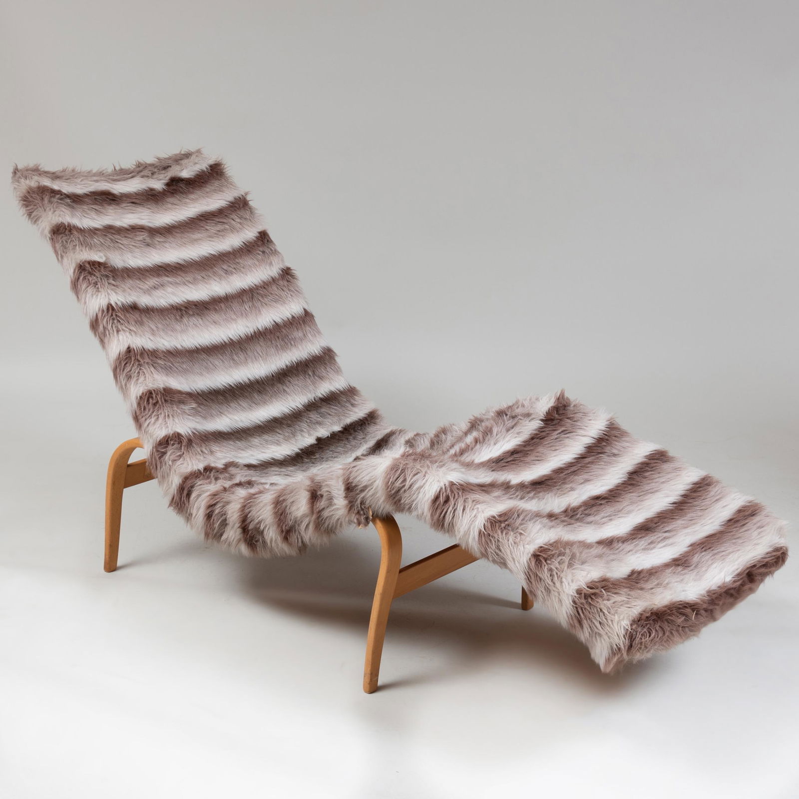 Bruno Mathsson Birch and Faux Fur Chaise Lounge: Bruno Mathsson Birch and Faux Fur Chaise Lounge Stamped, 1960. Fitted with a metal plaque, 'Illums Bolighus, Kobenhaven' and a paper label, Illums Bolighus, AS. 32 1/2 x 5 ft. 4 in. x 21 in. Illums
