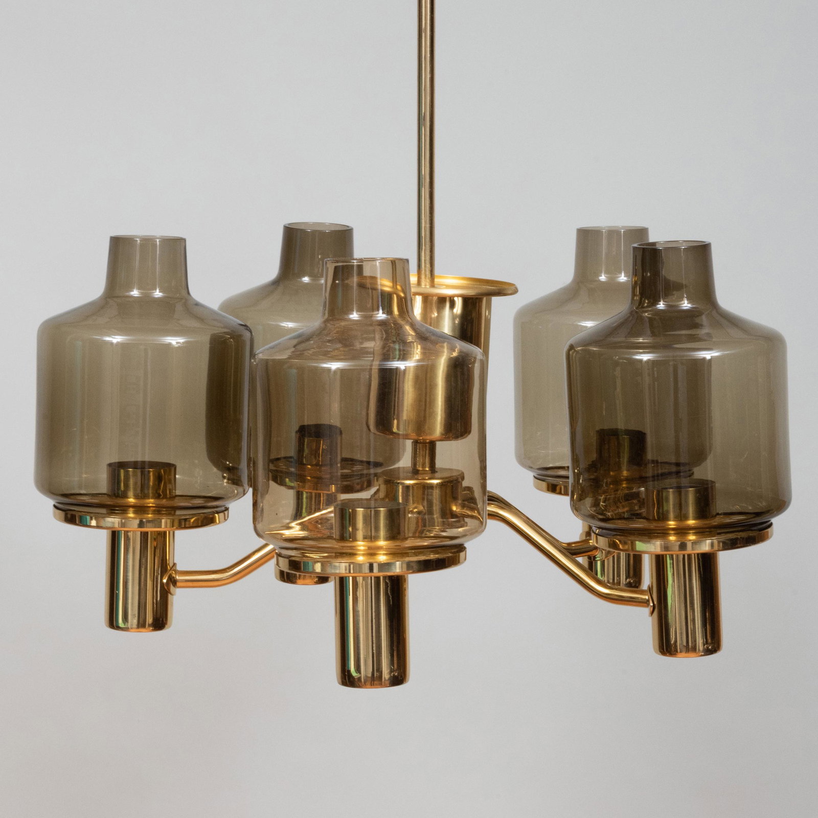 Hans-Agne Jakobsson Brass and Smoked Glass Five-Light: Hans-Agne Jakobsson Brass and Smoked Glass Five-Light Chandelier With label. 30 1/2 X 21 in. diam.