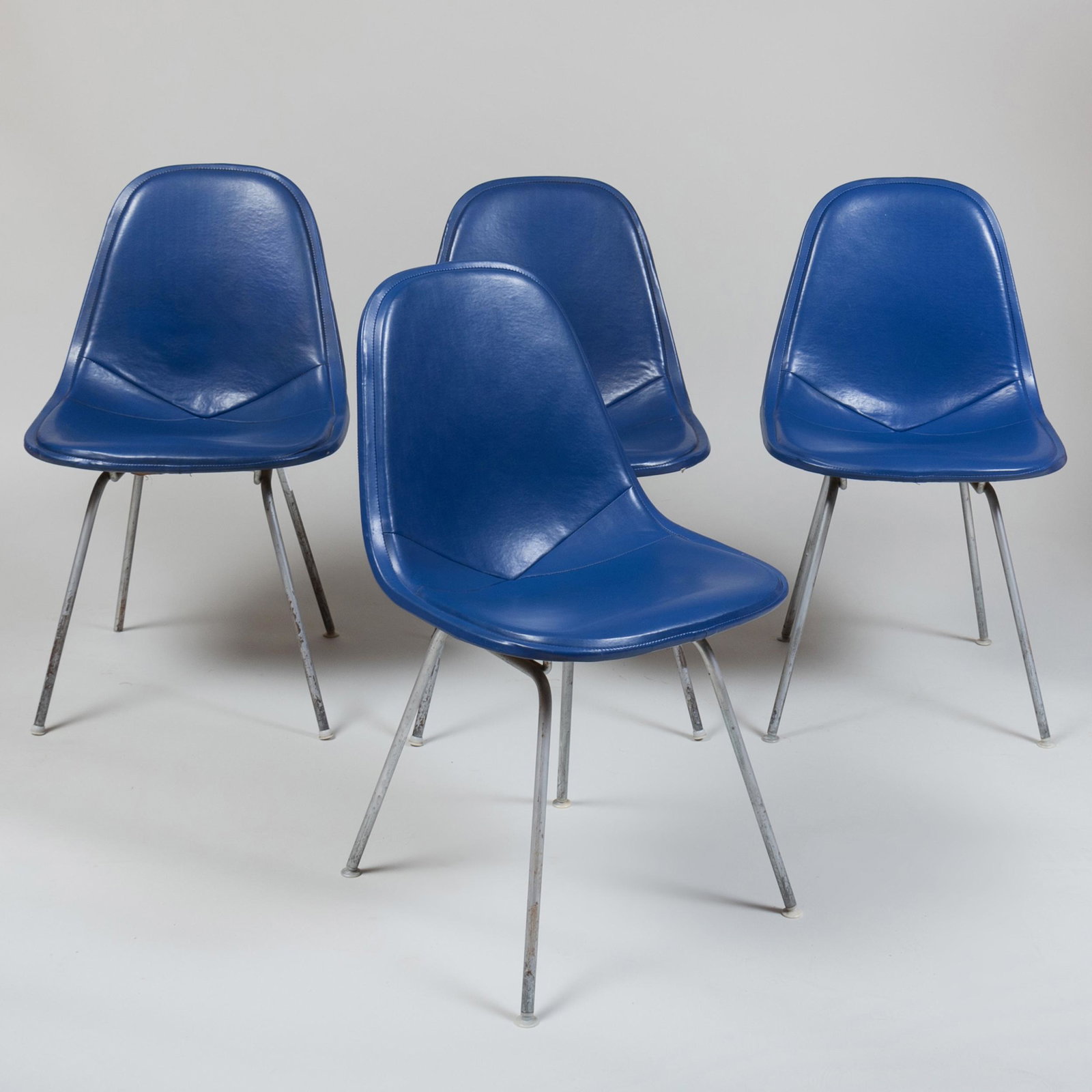 Four Charles and Ray Eames DKX Wire Chairs with Vinyl C: Four Charles and Ray Eames DKX Wire Chairs with Vinyl Covers 33 x 19 x 20 in.