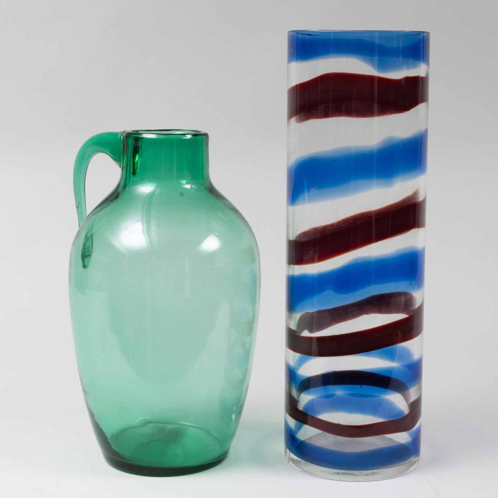 Blenko Green Glass Vessel with Handle and a Striped Ven: Blenko Green Glass Vessel with Handle and a Striped Venini Glass Cylindrical Vase The Venini signed in etch.The taller 22 in. high.