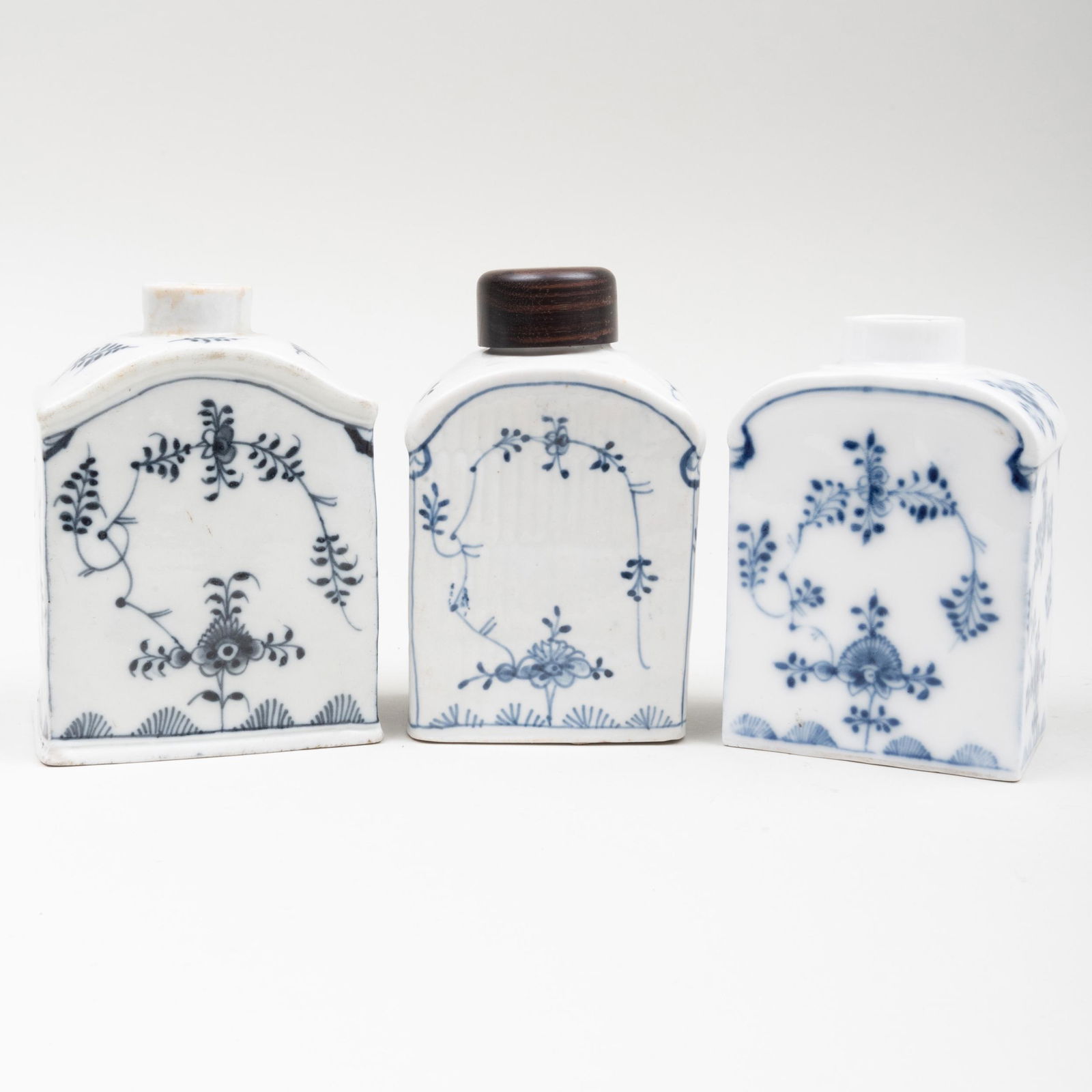 Three German Blue and White Porcelain Tea Caddies: Three German Blue and White Porcelain Tea Caddies Comprising: A Furstenberg caddy, blue crossed lines and ‘F’ markA Berlin caddy, blue sceptre markA German caddy with associated wood cover, unma