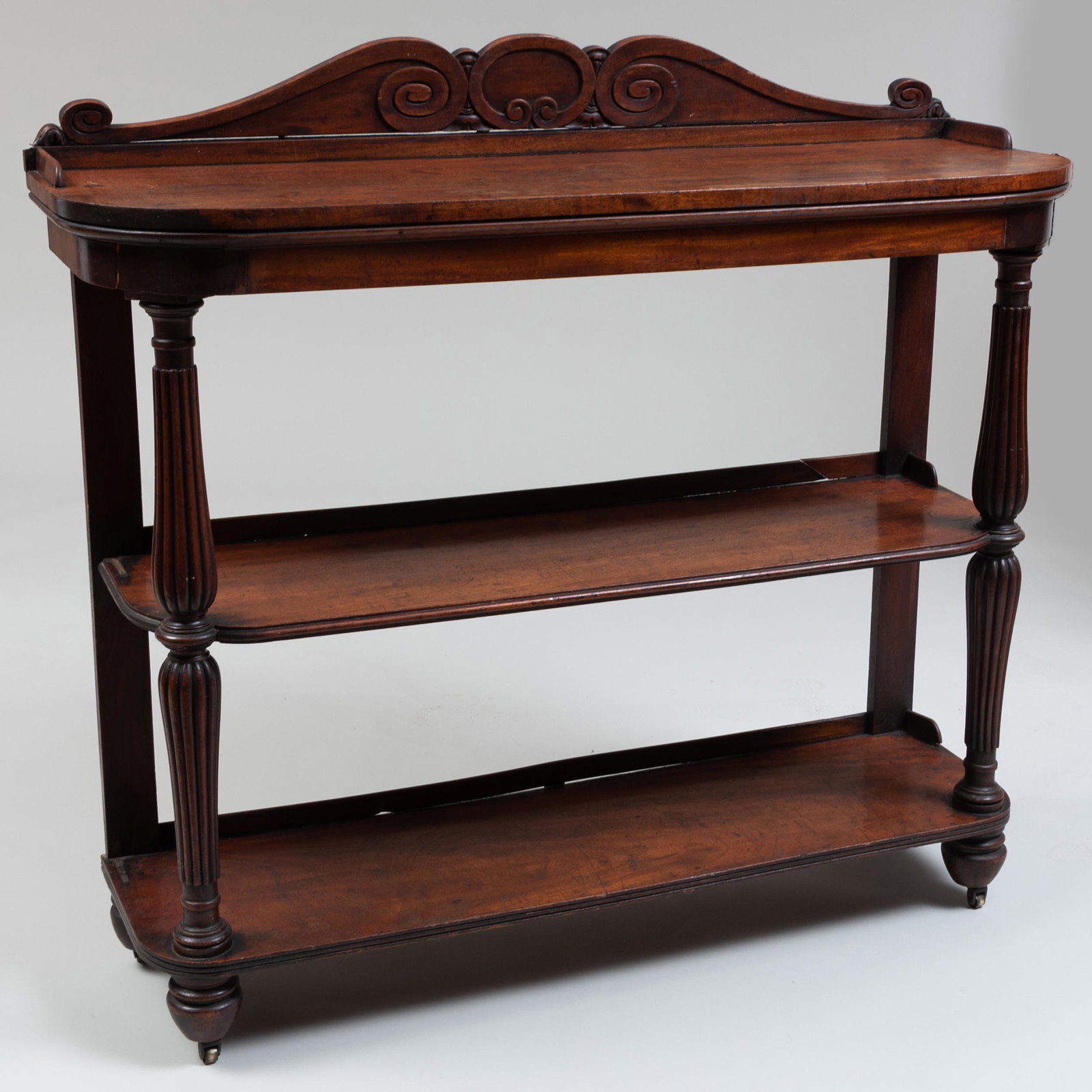 Early Victorian Mahogany Three-Tier Étagère: Early Victorian Mahogany Three-Tier Étagère Raised on casters. 43 3/4 x 47 1/2 x 16 1/4 in. John Richardson: A Scholar Collects