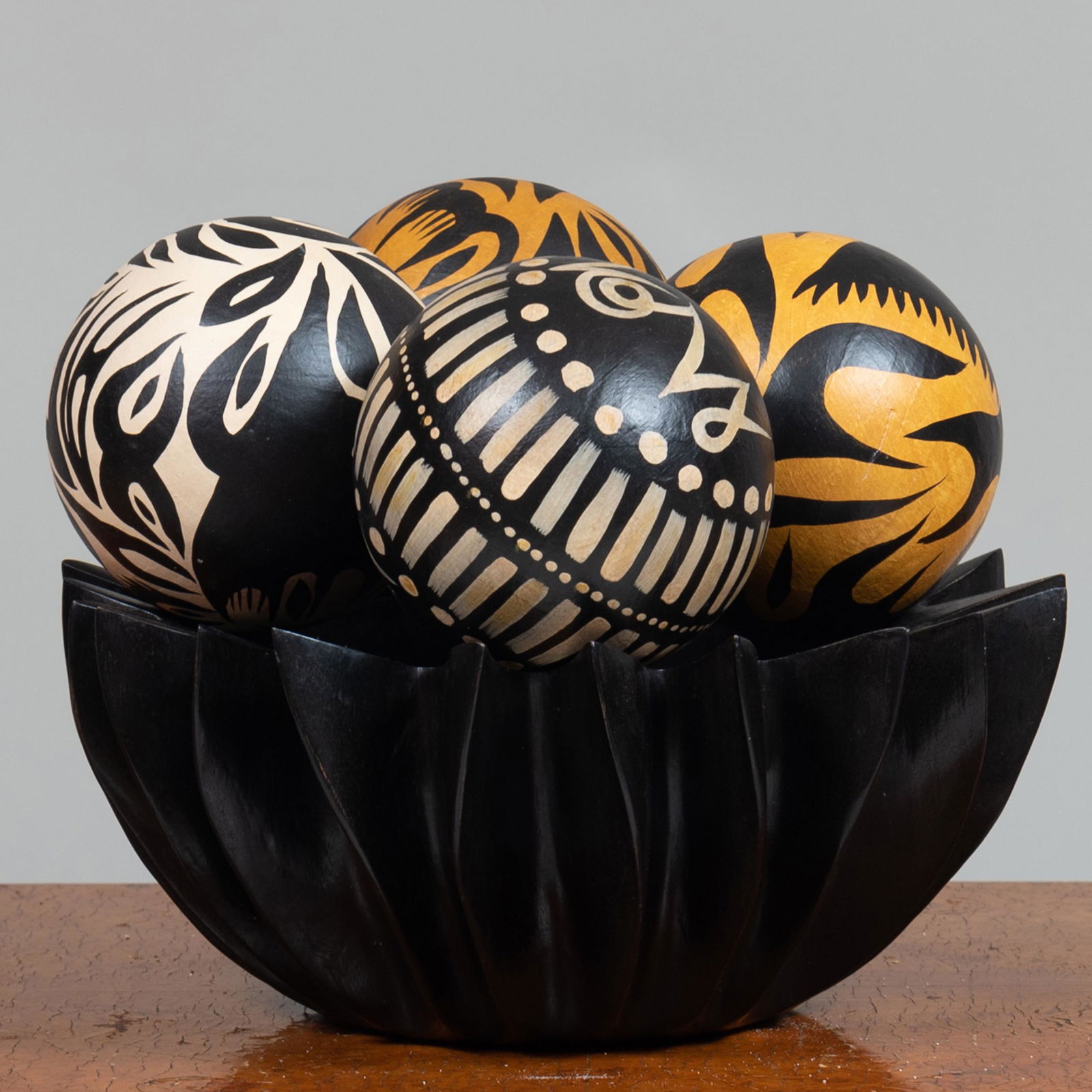 Modern Carved Ebony Wood Bowl and Group of Papier Mâché: Modern Carved Ebony Wood Bowl and Group of Papier Mâché Spheres Together with small metal stands for spheres. The largest sphere 6 x 13 1/2 in. John Richardson: A Scholar Collects