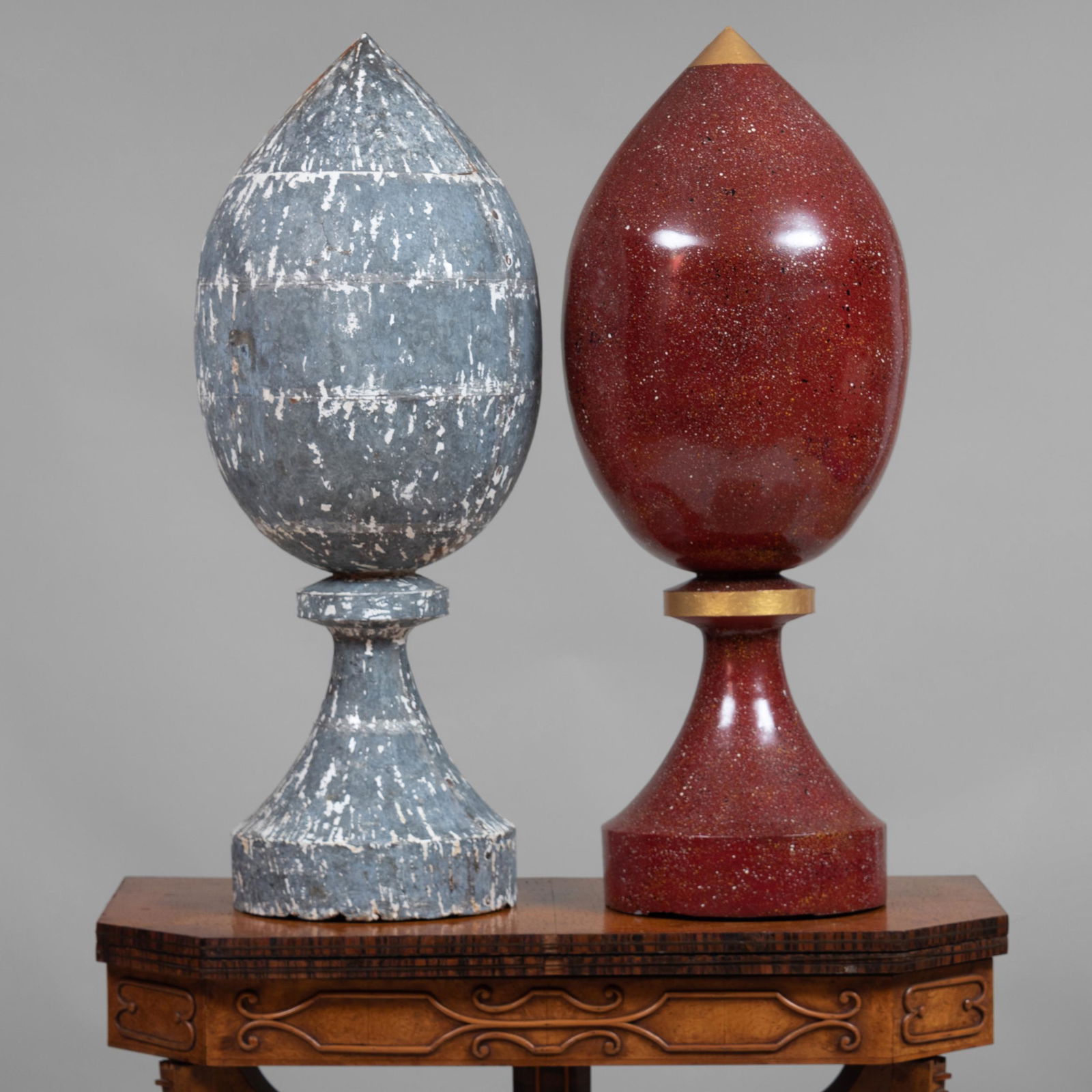 Two Painted Zinc Finials: Two Painted Zinc Finials The first with a faux porphyry finish, the other grey. 35 x 12 in. diam. John Richardson: A Scholar Collects