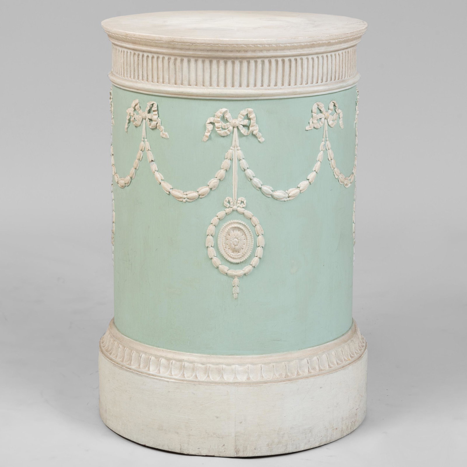 George III Style Painted Wood Circular Pedestal: George III Style Painted Wood Circular Pedestal Fitted with one door enclosing one shelf. 33 x 21 1/4 in. John Richardson: A Scholar Collects