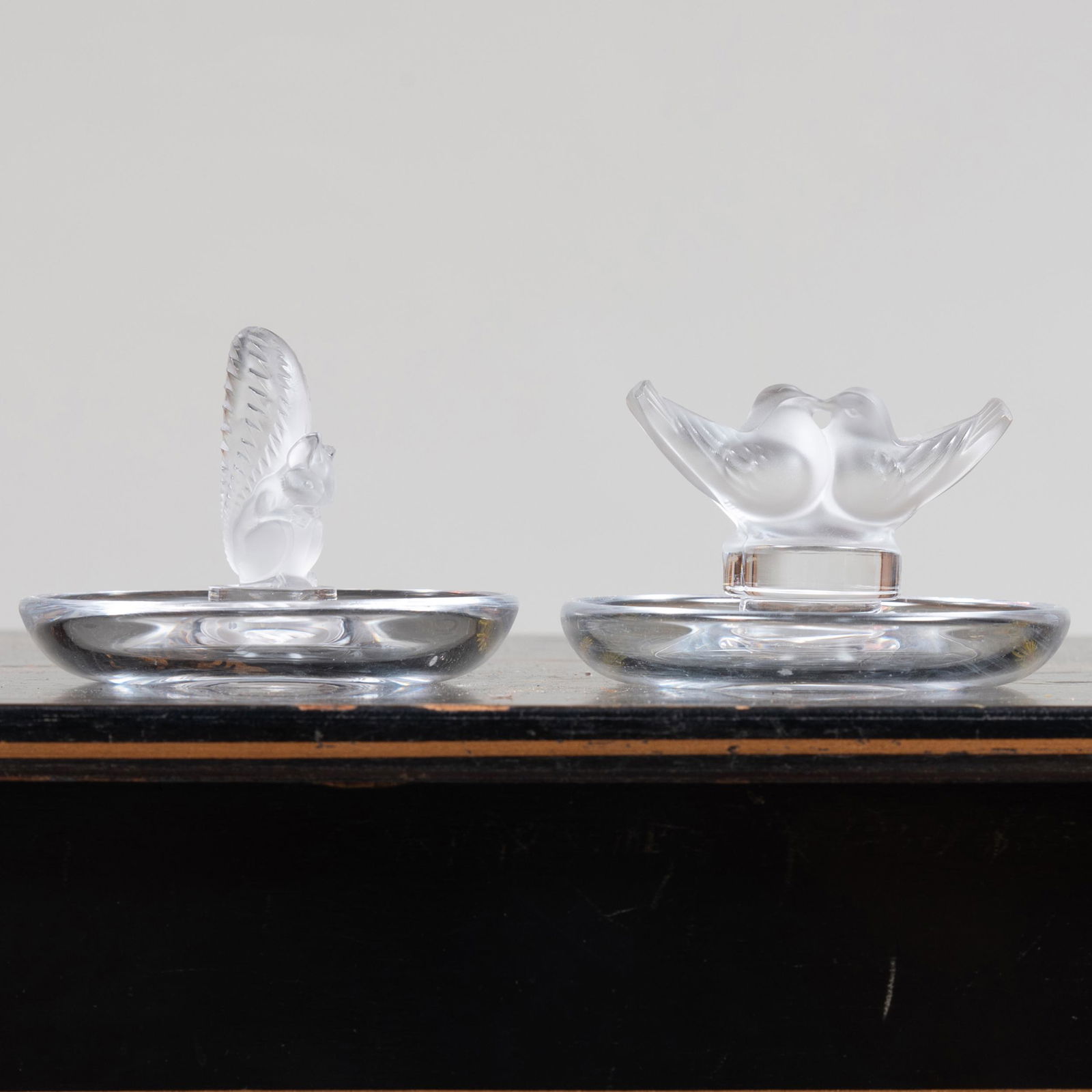 Two Lalique Glass Ring Holders: Two Lalique Glass Ring Holders Signed in etch. 3 3/4 in. diam. John Richardson: A Scholar Collects