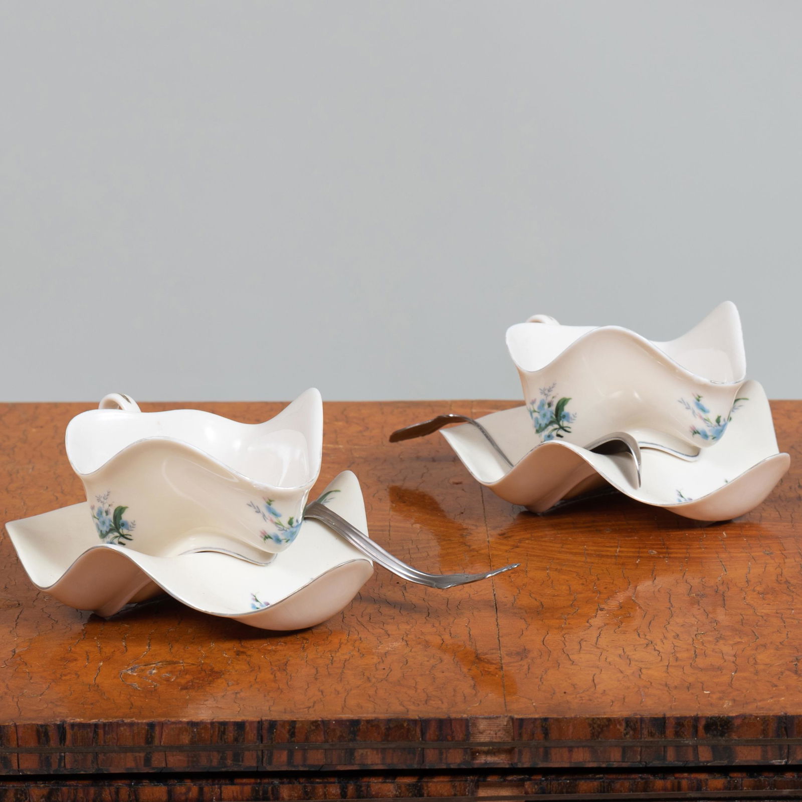 Robert Lazzarini (b. 1965): Peter Norton Family: Robert Lazzarini (b. 1965): Peter Norton Family Christmas Project/Tea Cup: A Pair A pair of porcelain tea cups and saucers with spoons, 2003, with the Christmas Project stamps on the bottom of each cu