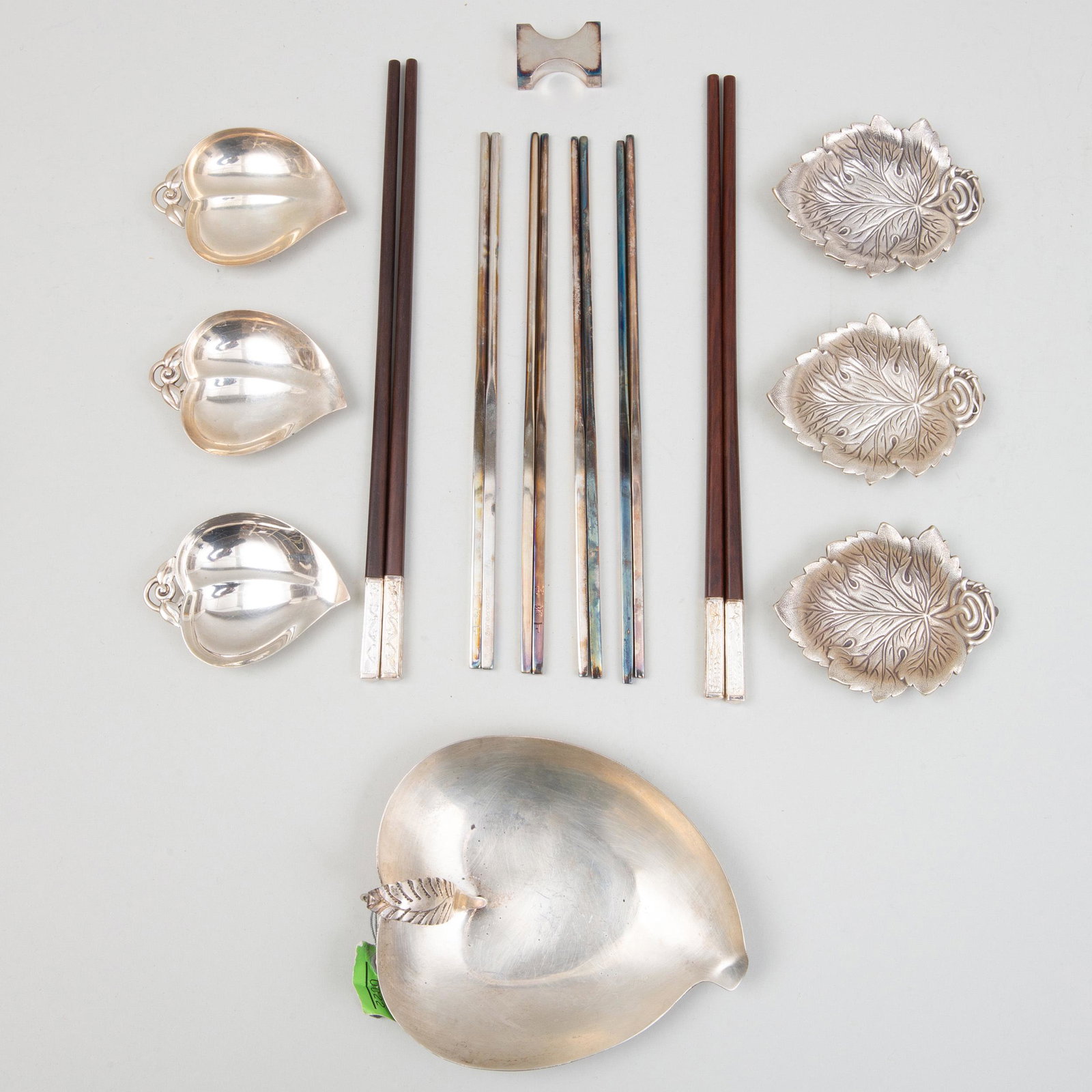 Group of Silver Table Wares: Group of Silver Table Wares Variously marked. Comprising: Six pairs of silver-mounted chopsticks Twelve Gorham leaf form vide poche, marked 'Sterling' Four American peach form dishes, marked 'Sterling