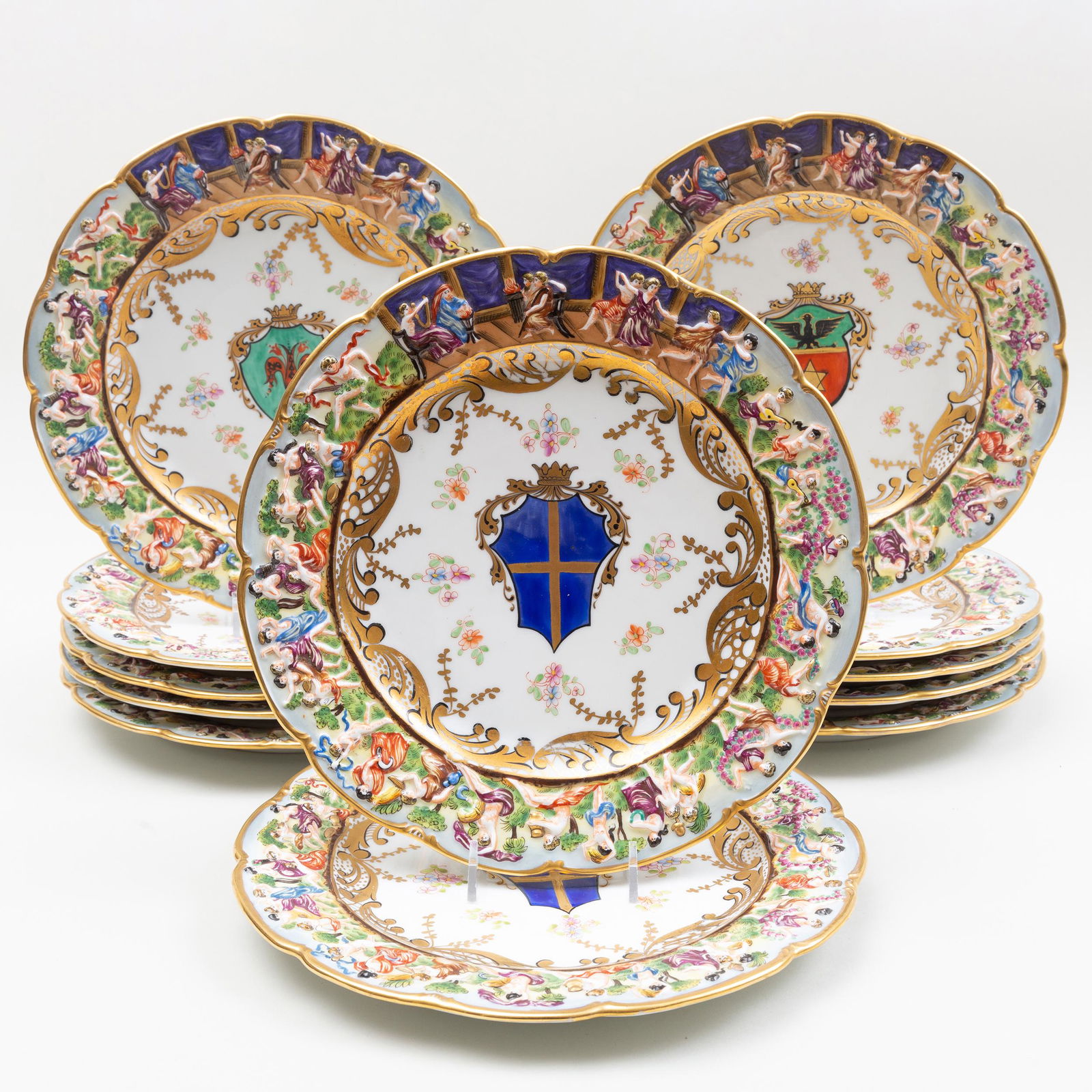 Twelve Capodimonte Style Porcelain Armorial Chargers: Twelve Capodimonte Style Porcelain Armorial Chargers with the 'Arms of Venice' Blue crowned 'N' mark. 10 1/4 in. diam. Selected Property from the Collection of Mr. and Mrs. Gutfreund