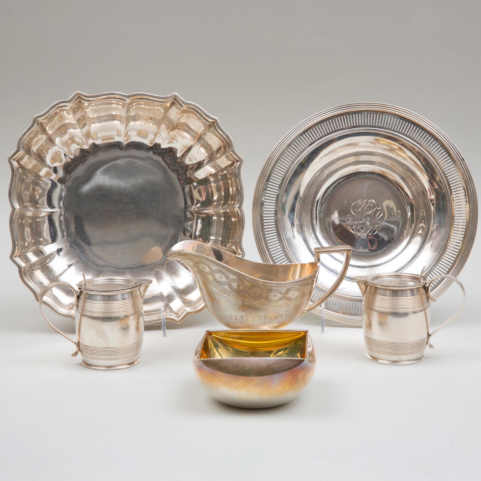 Group of American Silver Tablewares, Most Tiffany & Co.: Group of American Silver Tablewares, Most Tiffany & Co. Comprising: A pair of Tiffany & Co. barrel form cruets A Tiffany & Co. sauce boat A Tiffany & Co. shaped square dish A Frank W. Smith shaped bow