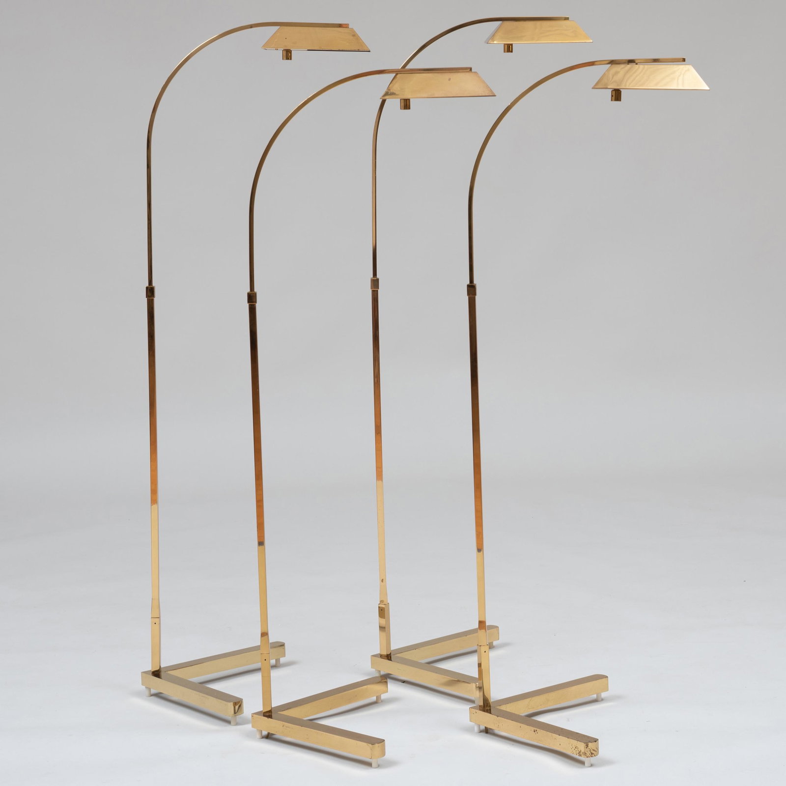 Group of Four Casella Brass Retractable Reading Lamps: Group of Four Casella Brass Retractable Reading Lamps With label. The tallest 49 x 16 1/2 x 18 in. Selected Property from the Collection of Mr. and Mrs. Gutfreund
