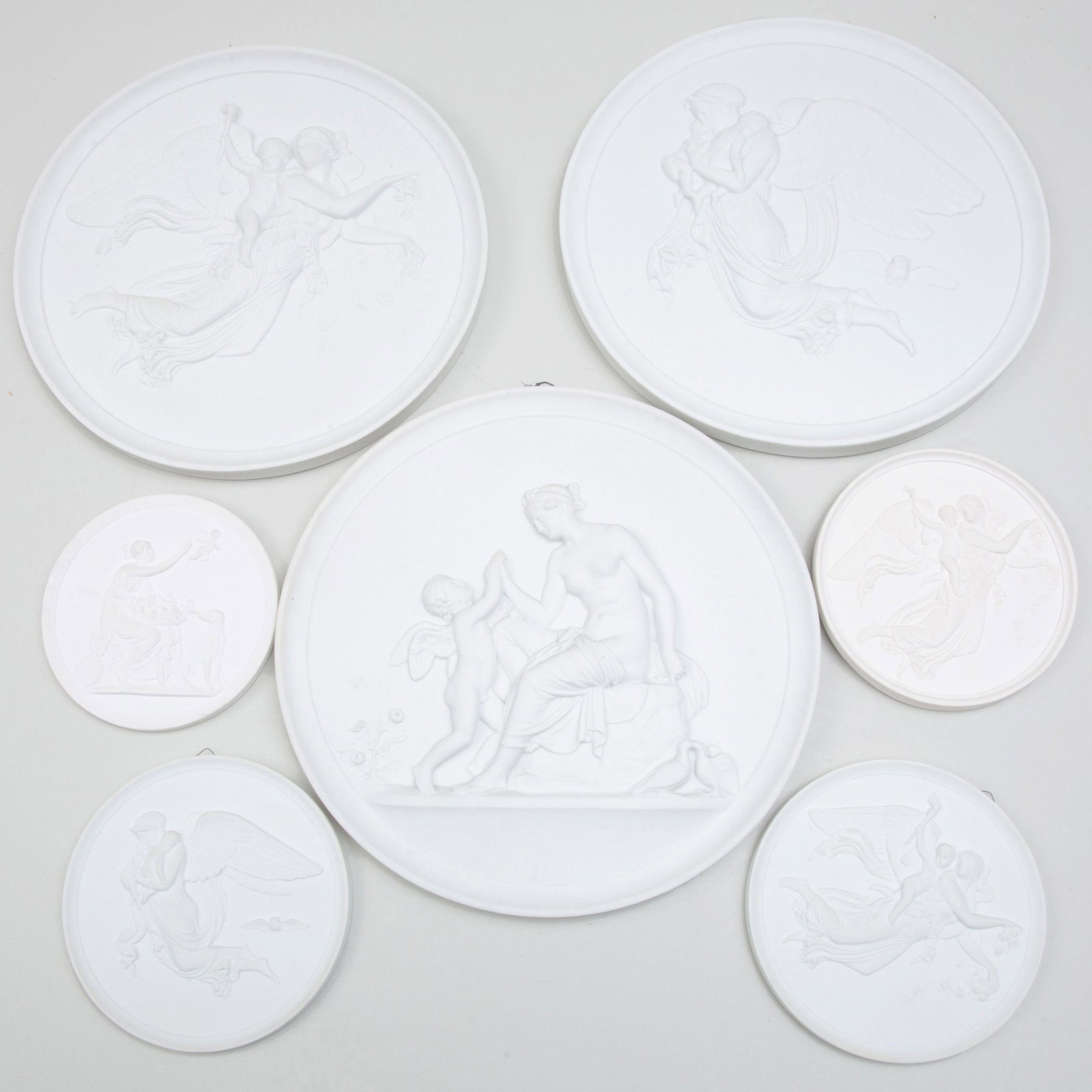 Group of Five Danish Biscuit Porcelain Rondels: Group of Five Danish Biscuit Porcelain Rondels All modeled after Thorwaldsen. Three Bing and Grondahl plaques Two Royal Copenhagen plaques, triple blue wave over green printed mark Together with plast