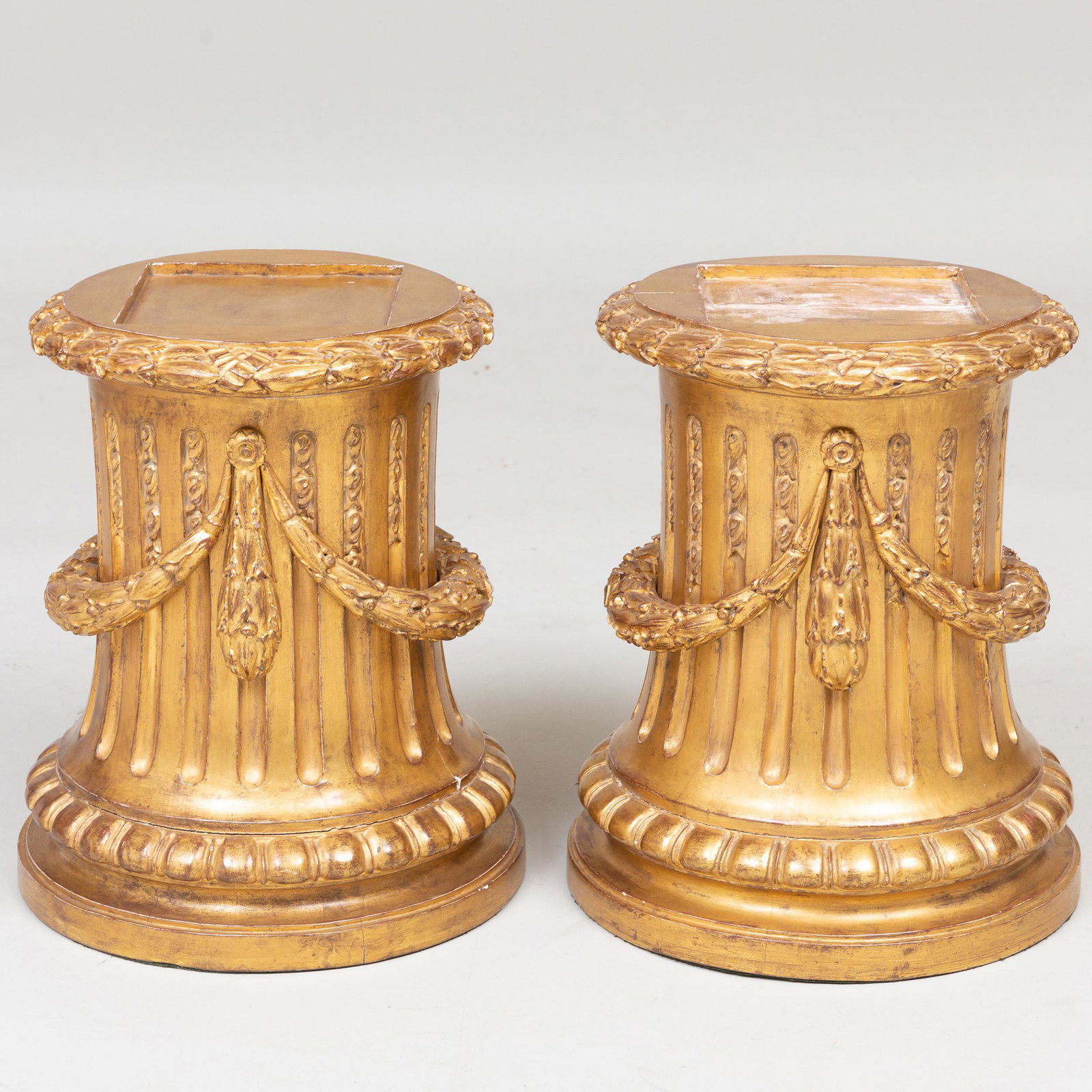 Pair of Louis XVI Style Giltwood Fluted Plinths: Pair of Louis XVI Style Giltwood Fluted Plinths 17 x 12 3/4 in. diam. Henri Samuel, Paris. Selected Property from the Collection of Mr. and Mrs. Gutfreund