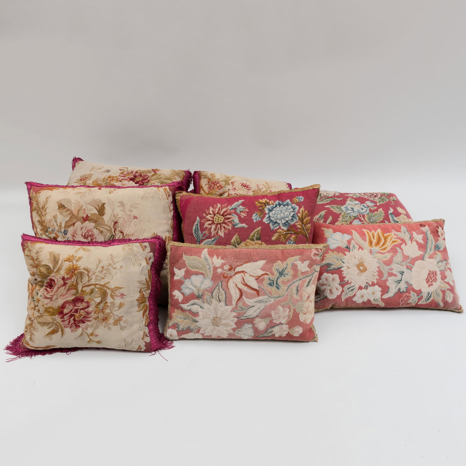 Group of Ten Aubusson and Needlework Floral Pillows: Group of Ten Aubusson and Needlework Floral Pillows Comprising: Six Aubusson tapestry pillows with fringe Two polychrome tapestry pillows with gilt trim Two polychrome needlework pillows with gilt tri