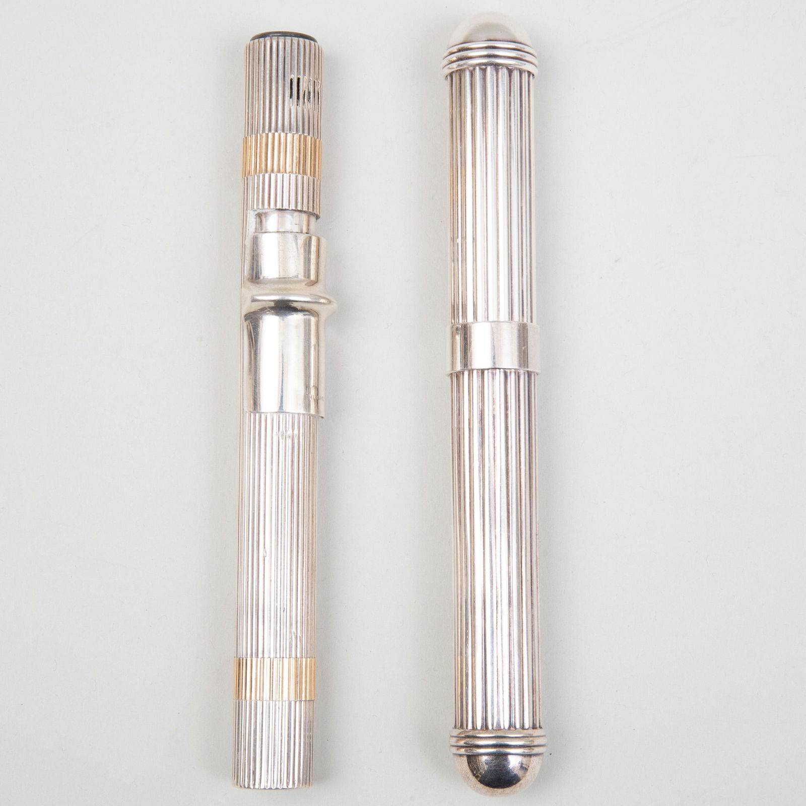 Christofle Silver Plate Cigar Case and Silver Cigar: Christofle Silver Plate Cigar Case and Silver Cigar Lighter The lighter marked '.925'. The case 7 3/4 in. long, the lighter 7 1/4 in. long. Selected Property from the Collection of Mr. and Mrs. Gutfre