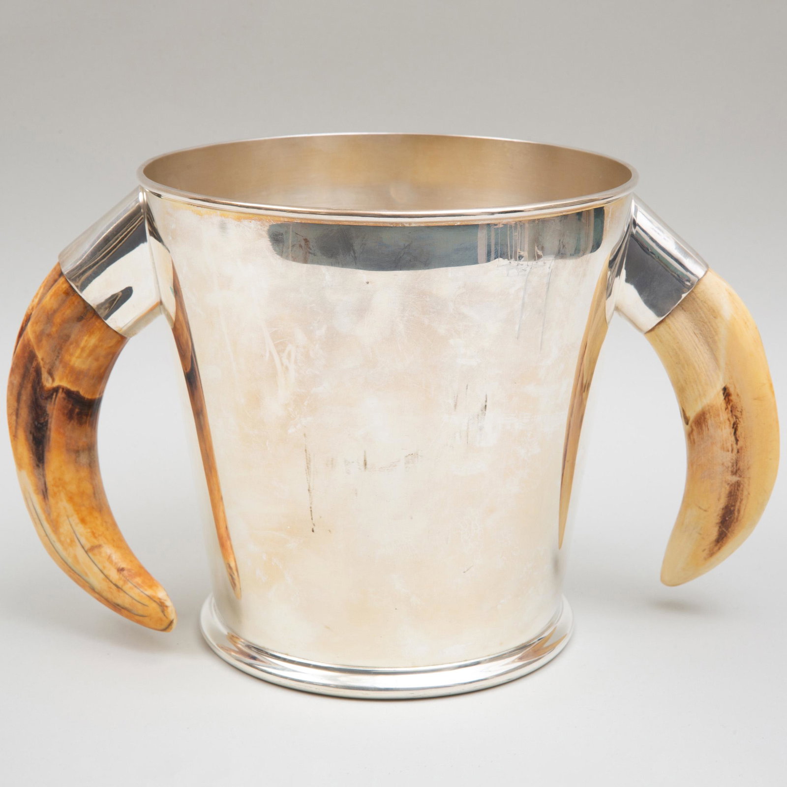 English Silver Plate Boar Tusk Mounted Wine Cooler: English Silver Plate Boar Tusk Mounted Wine Cooler 8 1/4 x 8 1/4 in. x diam. Selected Property from the Collection of Mr. and Mrs. Gutfreund