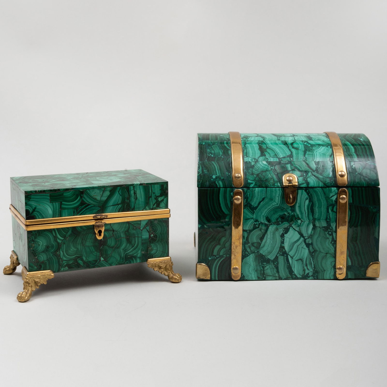 Two Continental Brass-Mounted Malachite Table Boxes: Two Continental Brass-Mounted Malachite Table Boxes The larger 5 3/4 x 7 1/2 x 5 1/2 in., the smaller 4 1/4 x 6 1/2 x 4 1/4 in.