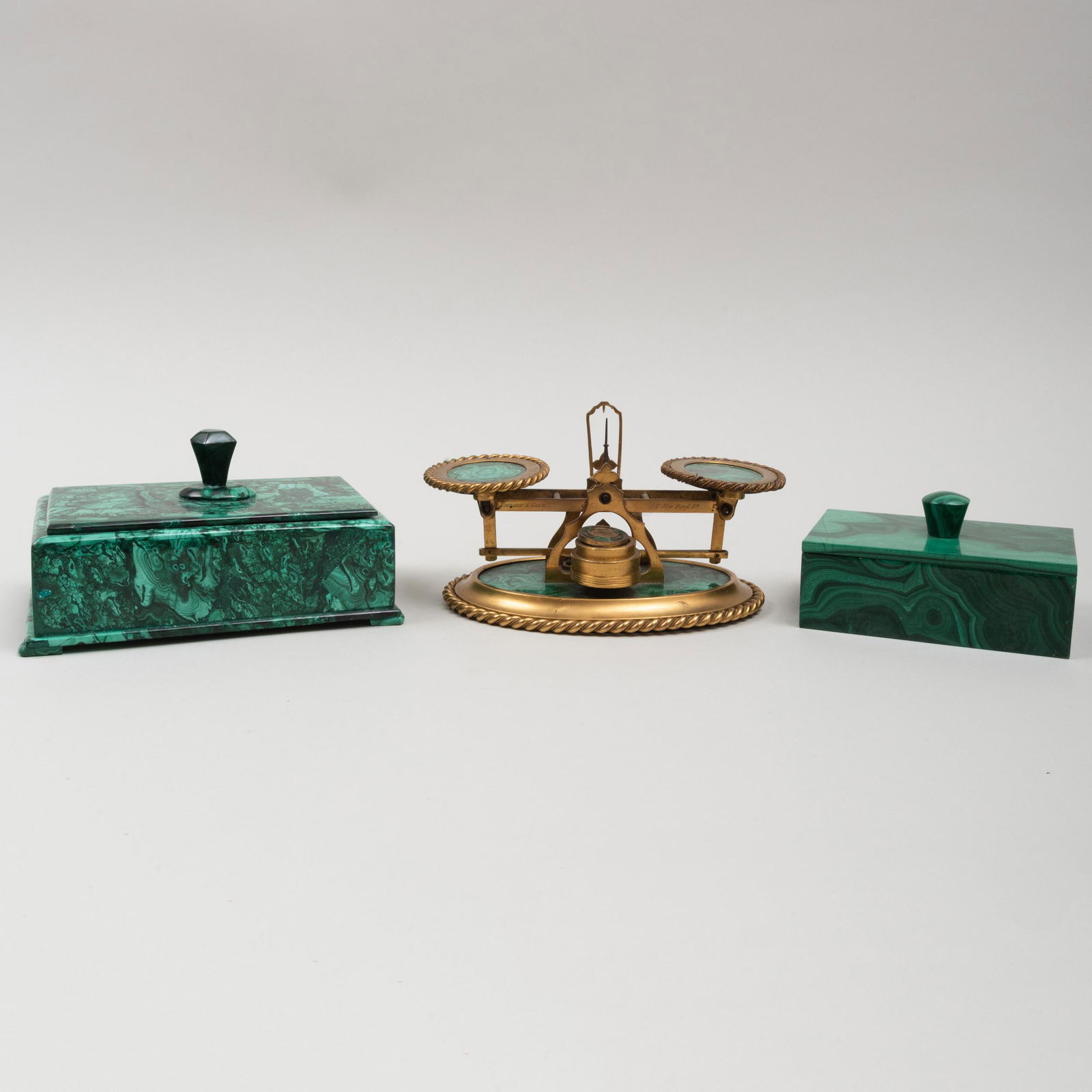 Toulmin & Gale Brass and Malachite Scale and Two: Toulmin & Gale Brass and Malachite Scale and Two Continental Malachite Boxes with Knob Handles The scale with engraved mark and '7 New Bond Street', with two weights; together with an enameled Persian