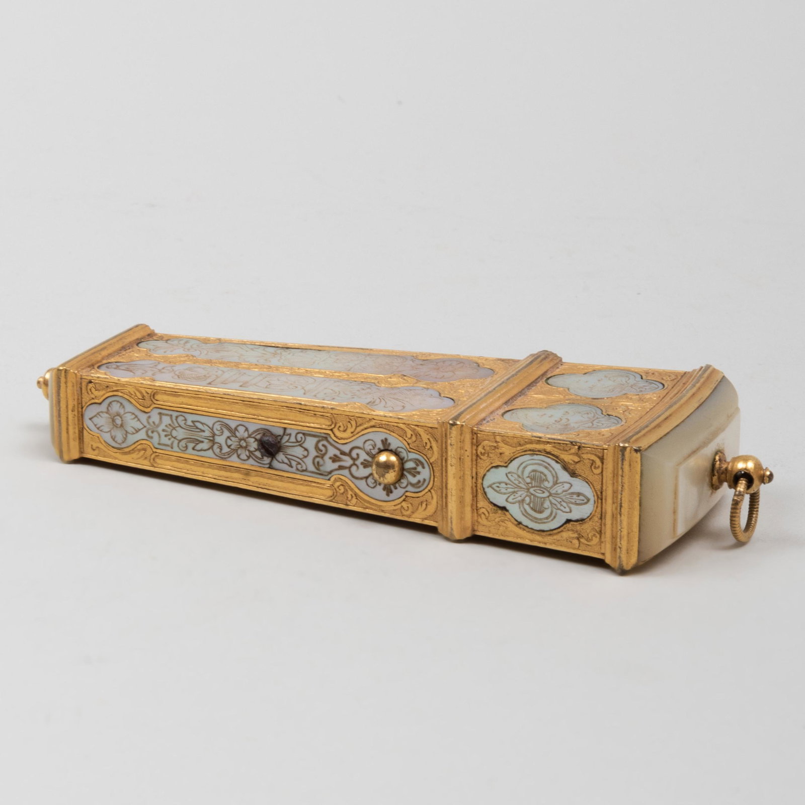 Continental Mother-of-Pearl Inlaid Gilt-Metal Wedge: Continental Mother-of-Pearl Inlaid Gilt-Metal Wedge Shaped Necessaire With fitted interior and tools. 4 1/2 in. high. Property from the Collection of Ezra & Cecile Zilkha