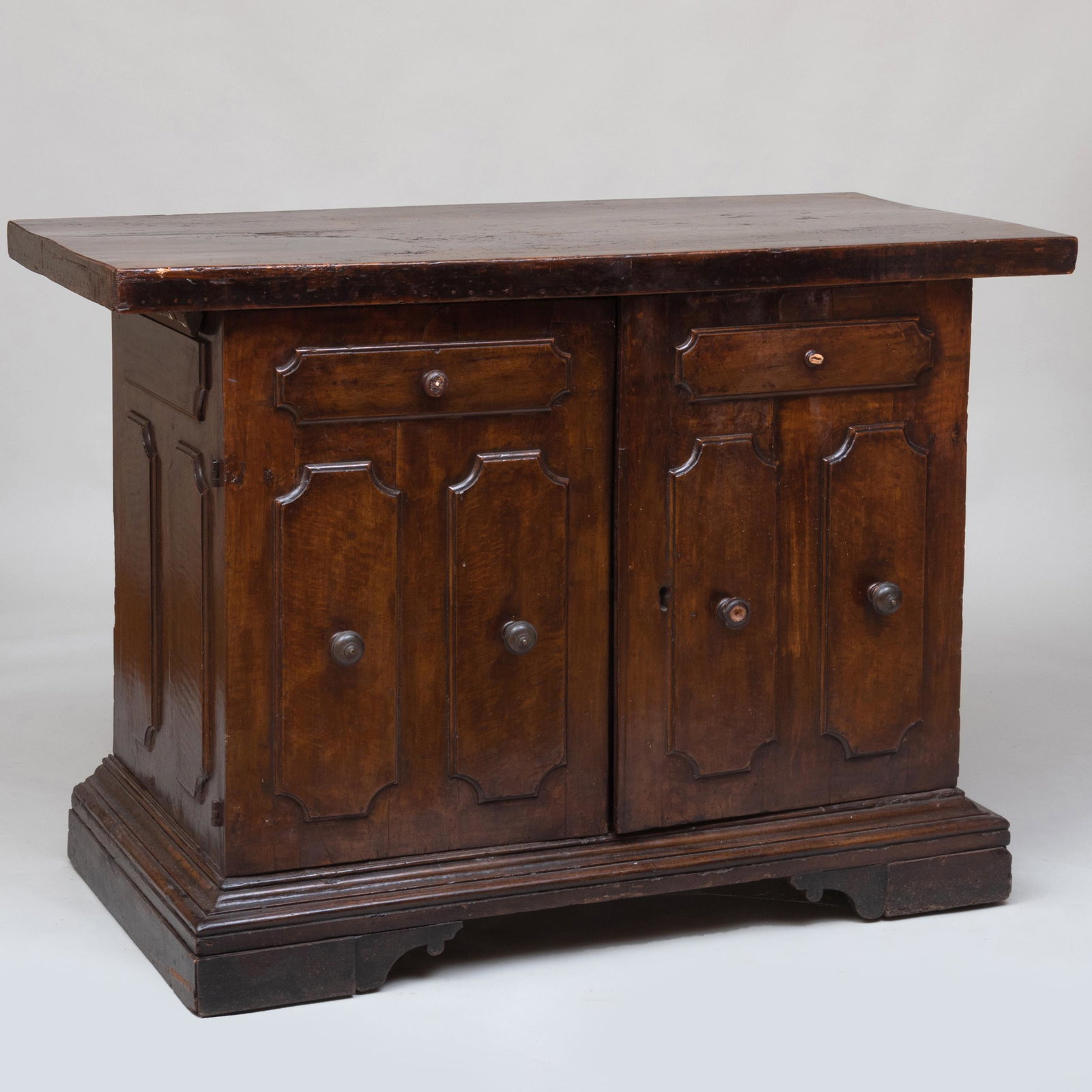 Italian Baroque Style Walnut Credenza, Probably Bologna: Italian Baroque Style Walnut Credenza, Probably Bologna Top and base later in date. The cupboard doors opening to one shelf. 40 x 4 ft. 9 in. x 27 1/4 in.