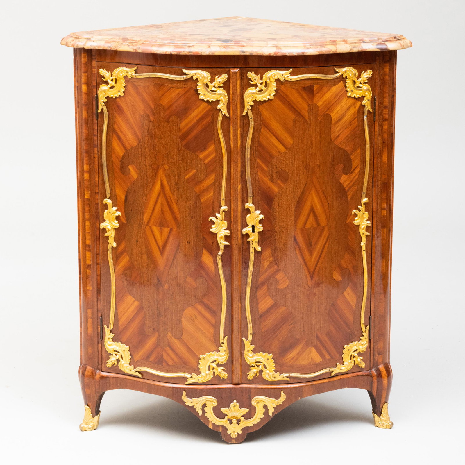 Early Louis XV Ormolu-Mounted Kingwood and Amaranth: Early Louis XV Ormolu-Mounted Kingwood and Amaranth Parquetry Encoignure, Stamped Doriat Étienne Doriat (1675-1732) was a French ébéniste during the Règence time period. Fitted with a Breche d'A