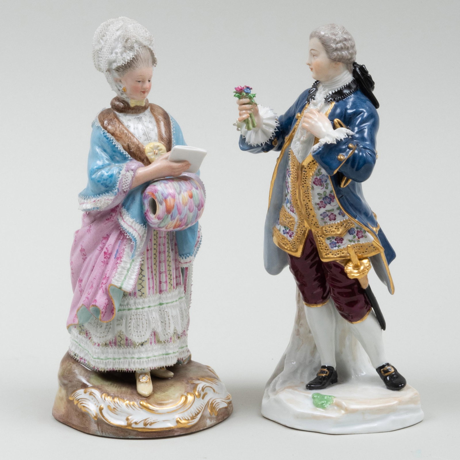 Meissen Porcelain Figure of a Gentleman in a Blue Coat: Meissen Porcelain Figure of a Gentleman in a Blue Coat and a Lady with a Muff Each with blue crossed swords and incised number marks. The gentleman 7 3/4 in. high, the lady 8 in. high.