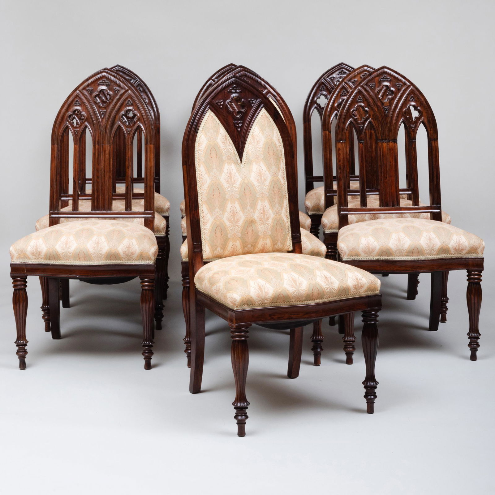 Set of Ten Continental Neo-Gothic Carved Rosewood: Set of Ten Continental Neo-Gothic Carved Rosewood Dining Chairs, Two of a Later Date 42 1/2 x 21 1/4 x 18 3/4 in. Height of seat 19 1/4 in. The Collection of Michael G. Moye, Greenwich, CT