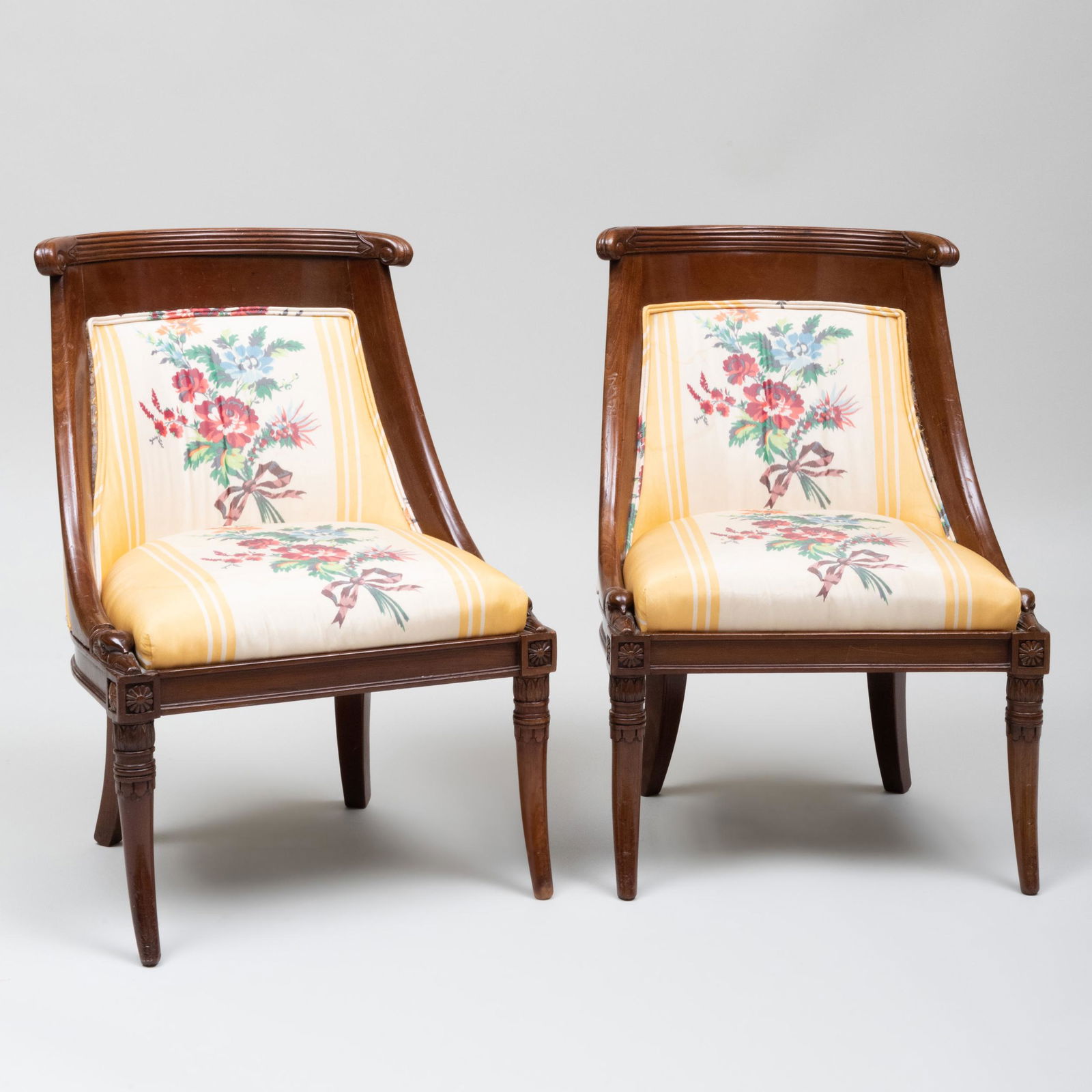 Pair of Small Empire Mahogany Chaises en Gondole: Pair of Small Empire Mahogany Chaises en Gondole Upholstered in floral silk fabric. 27 1/4 x 18 1/4 x 15 1/4 in.