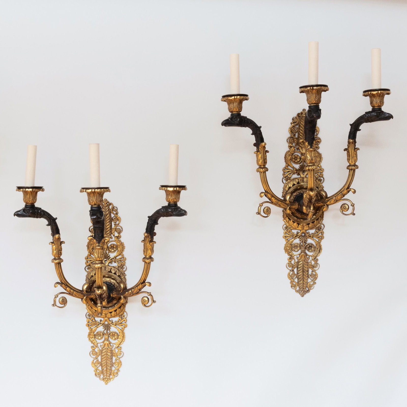 Pair of Empire Style Ormolu and Patinated-Bronze: Pair of Empire Style Ormolu and Patinated-Bronze Three-Light Sconces 25 x 6 x 16 in. Bernd Goeckler Antiques, NY, 1994. The Collection of Michael G. Moye, Greenwich, CT