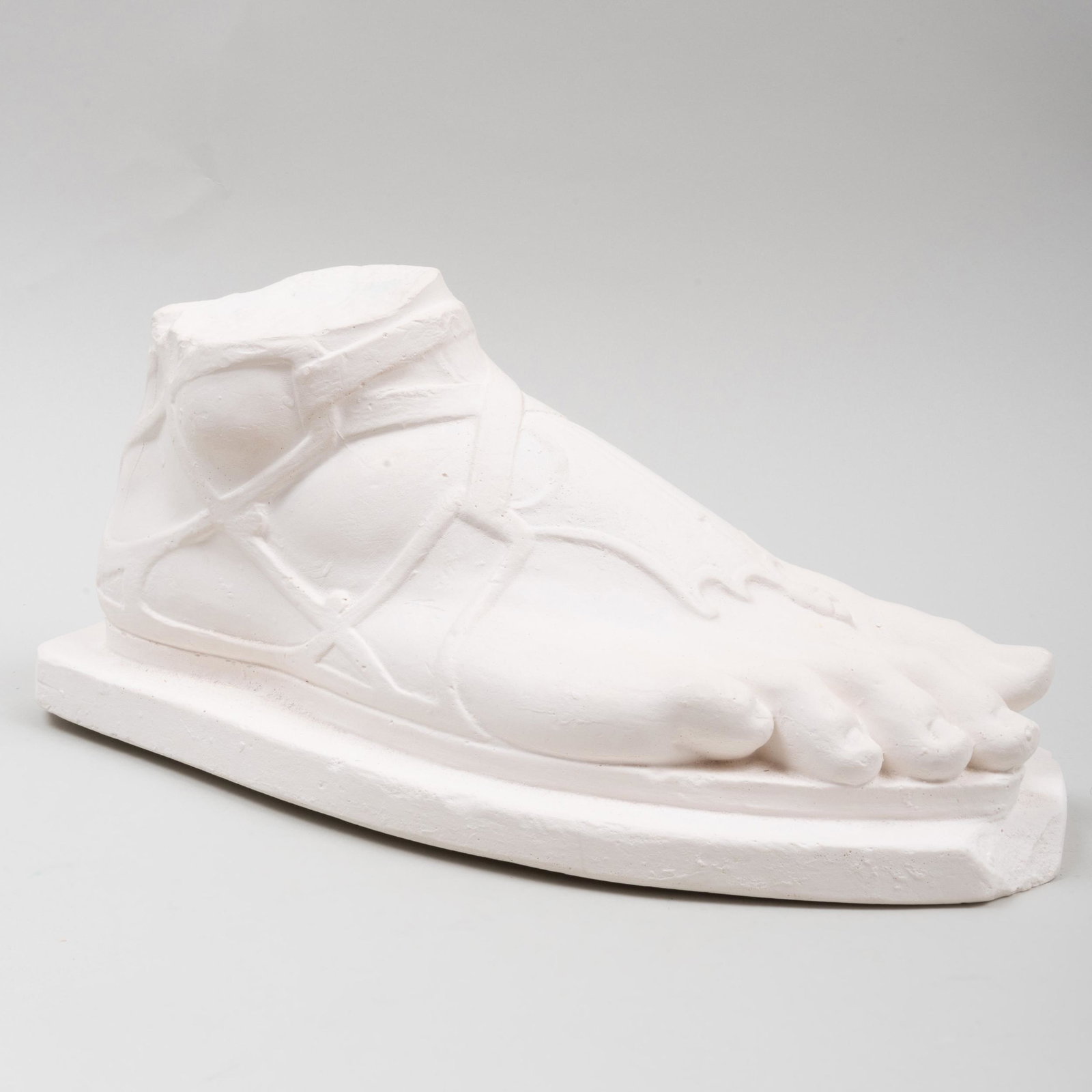 Plaster Model of a Foot, signed C. Bruce... & Co.,: Plaster Model of a Foot, signed C. Bruce... & Co., London, after the antique Marked in green under foot: P.J. Hone, London. 6 1/2 x 13 1/2 x 6 in.