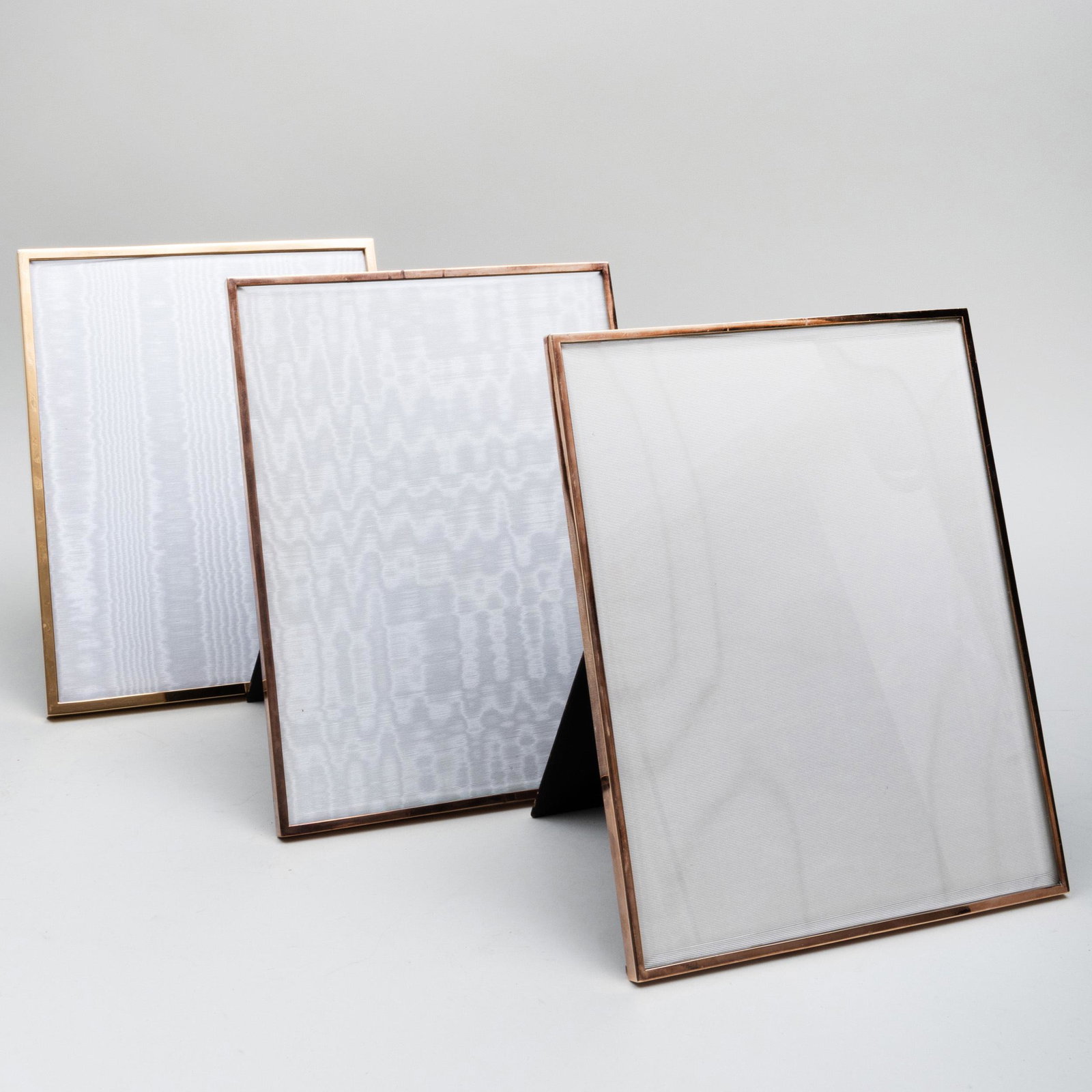 Three Large Jean Dinh Van Paris Silver-Gilt Picture: Three Large Jean Dinh Van Paris Silver-Gilt Picture Frames Each marked '.800'. All 10 x 8 1/8 in. The Private Collection of Jayne Wrightsman