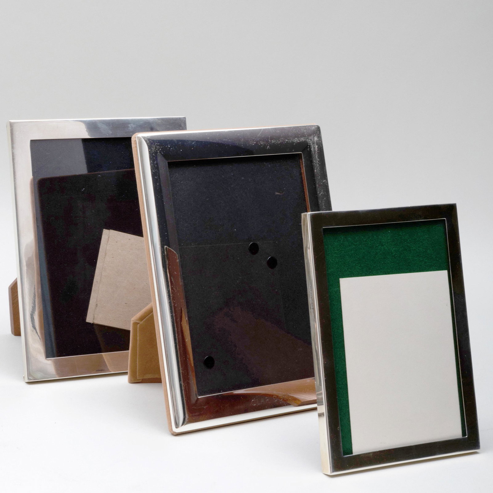 Two English Silver Picture Frames and a Silver Plate: Two English Silver Picture Frames and a Silver Plate Picture Frame Comprising: A small rectangular frame, marked Birmingham and '.925' A larger rectangular frame, marked Birmingham and '.925' A silver